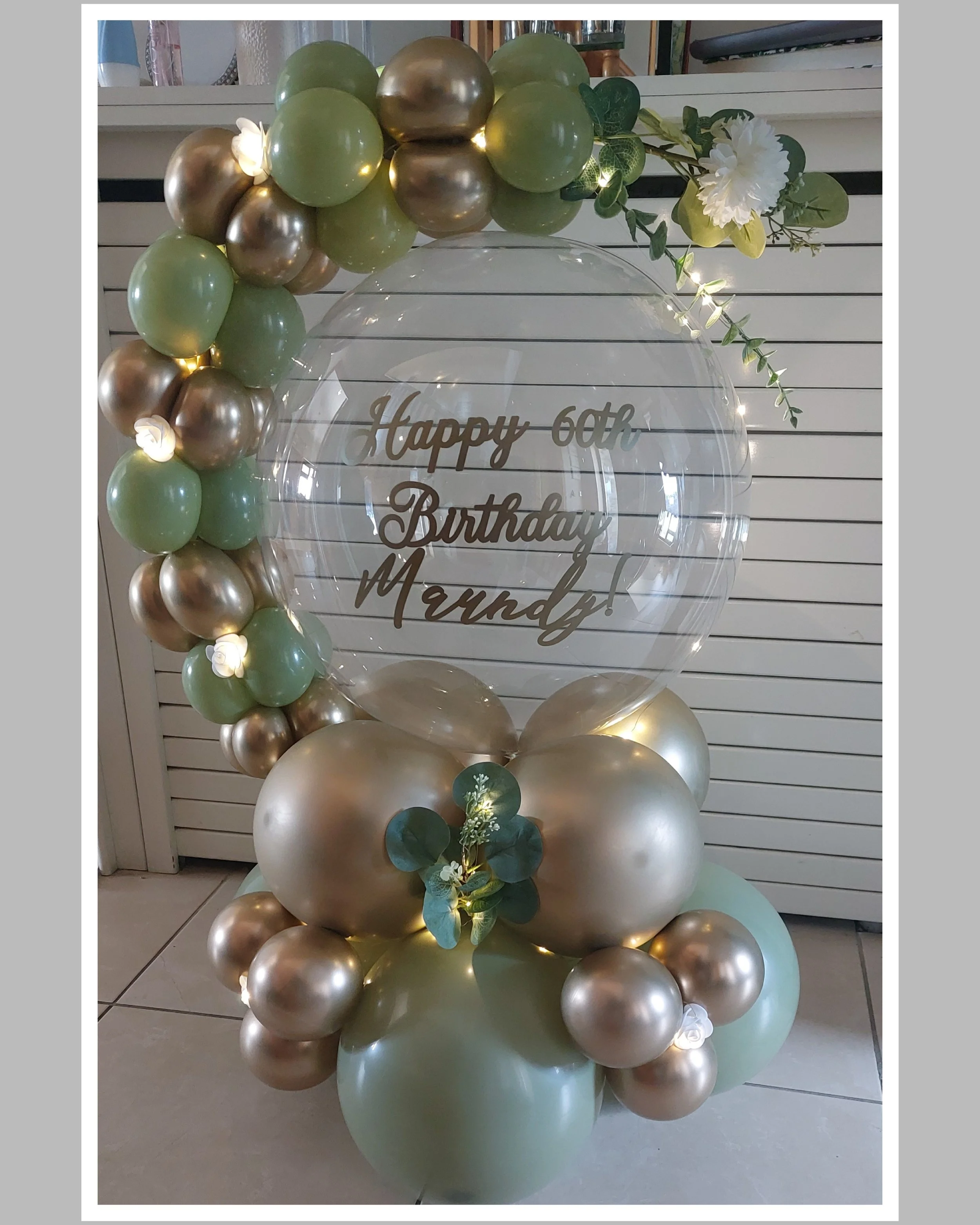 ITEM #174 --- Balloon hug with lights and flowers.