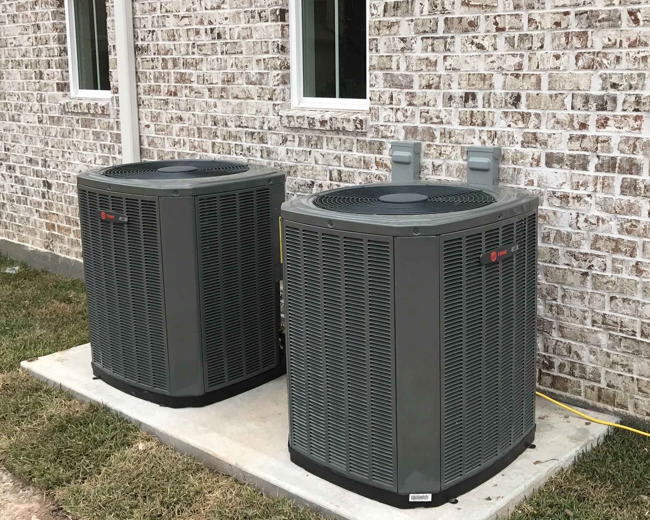 Professional installation of a high-efficiency AC condensing unit in Pearland, TX by Mabry's HVAC technicians.