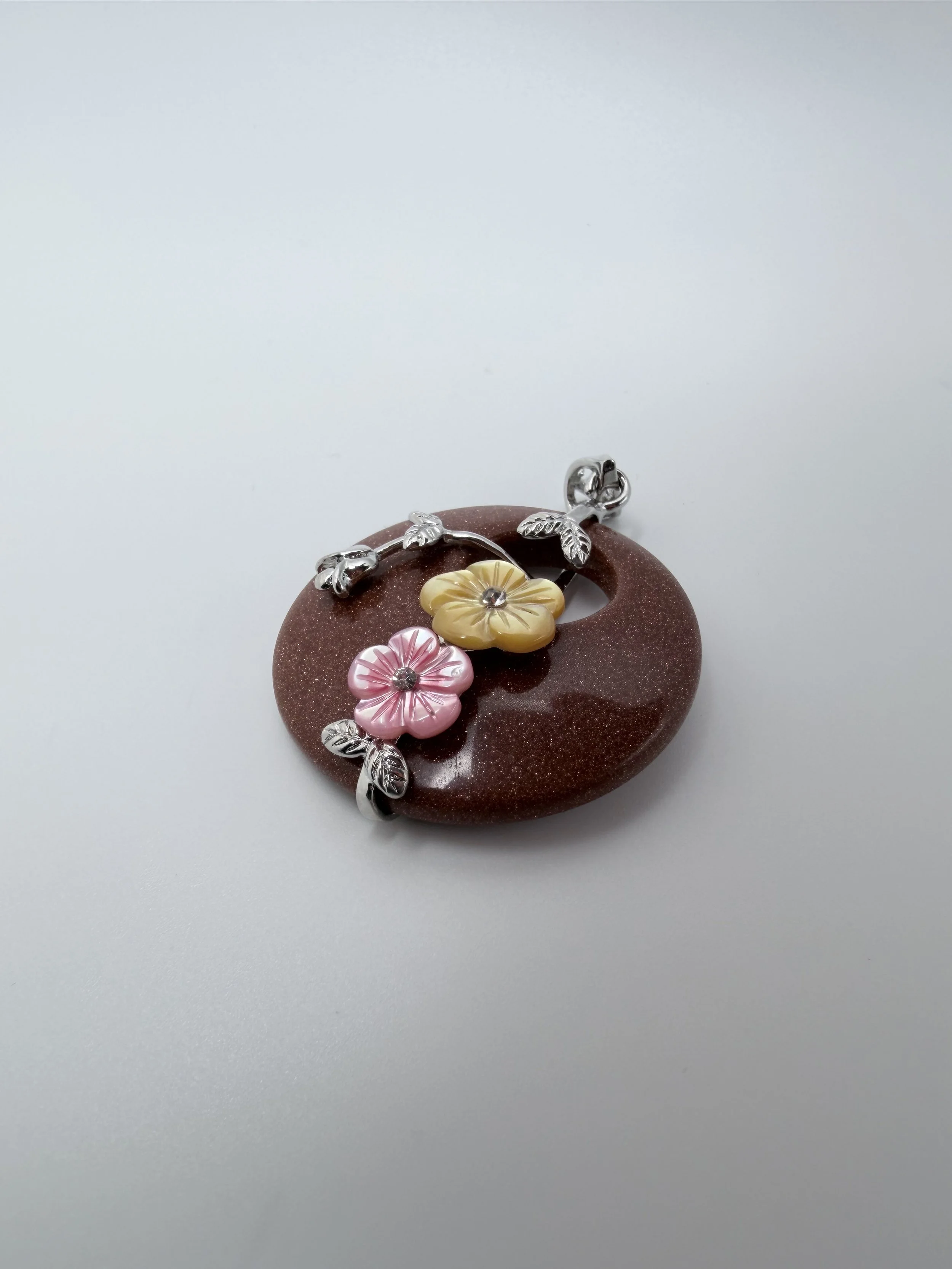 Goldstone Pendent with Sterling Silver Floral Accents