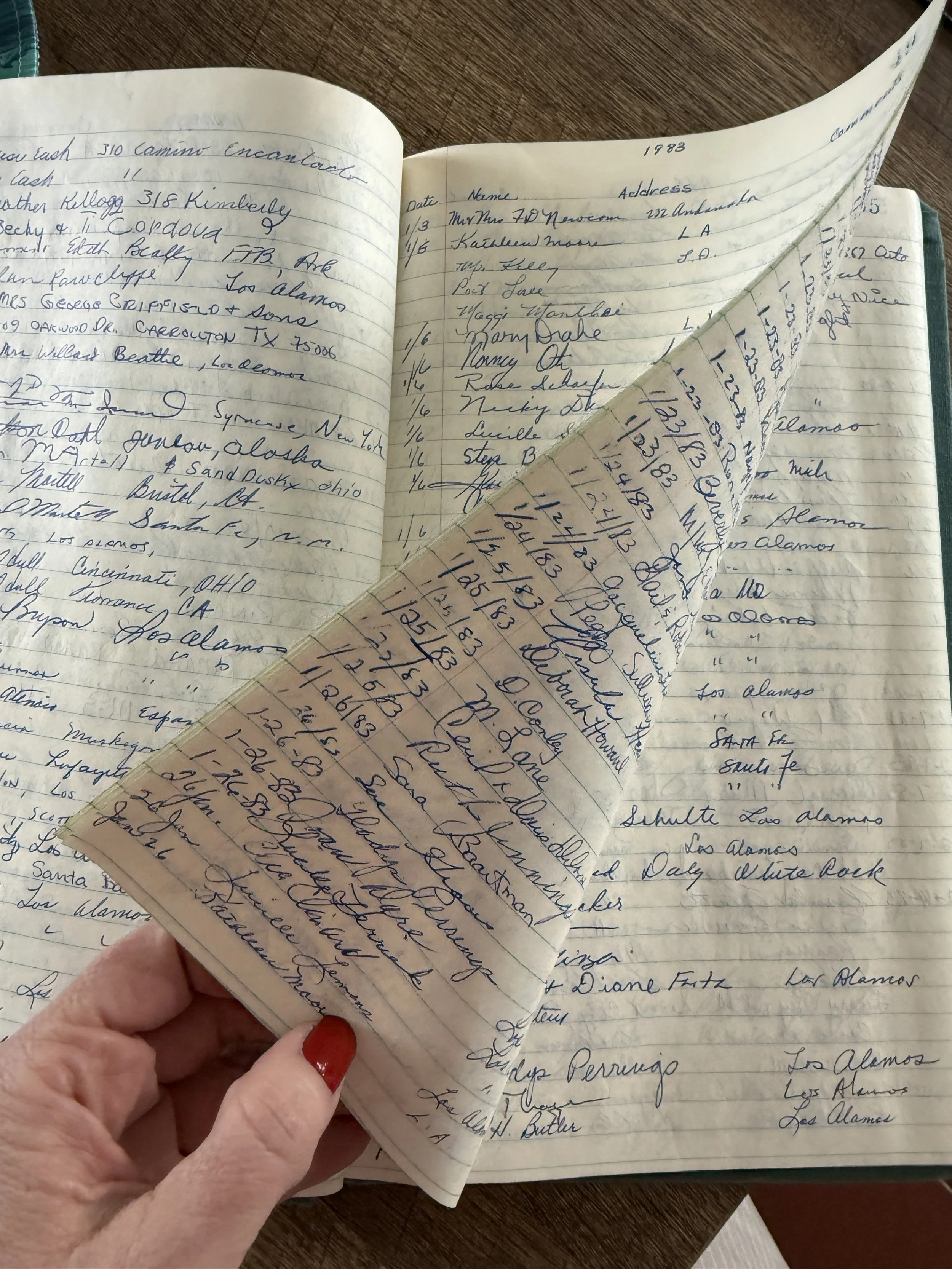 Image of a paper ledger page with names and dates from 1983 visitors to the Fuller Lodge Art Center