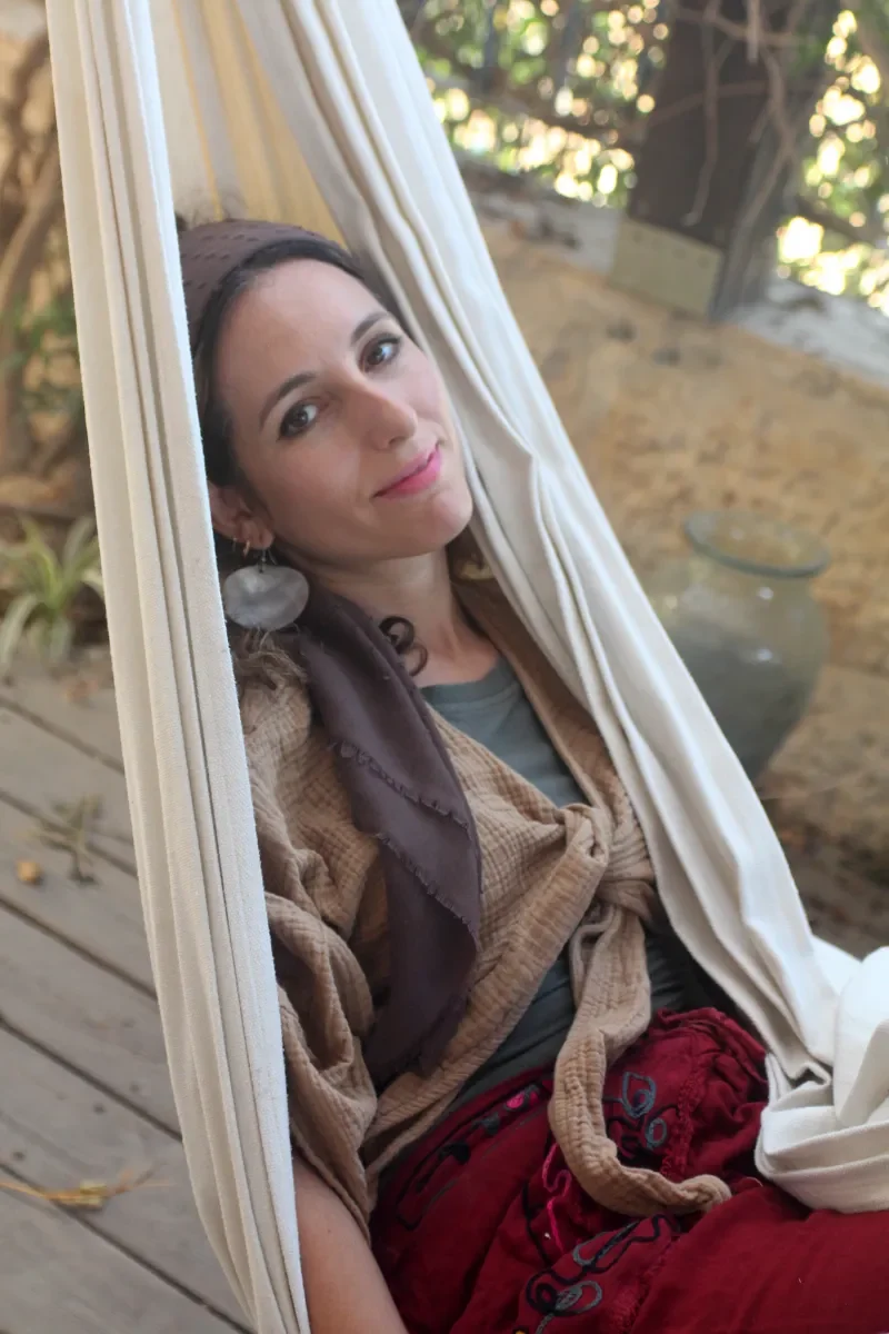Ruthie Ayzenberg relaxing in an outdoor hammock.