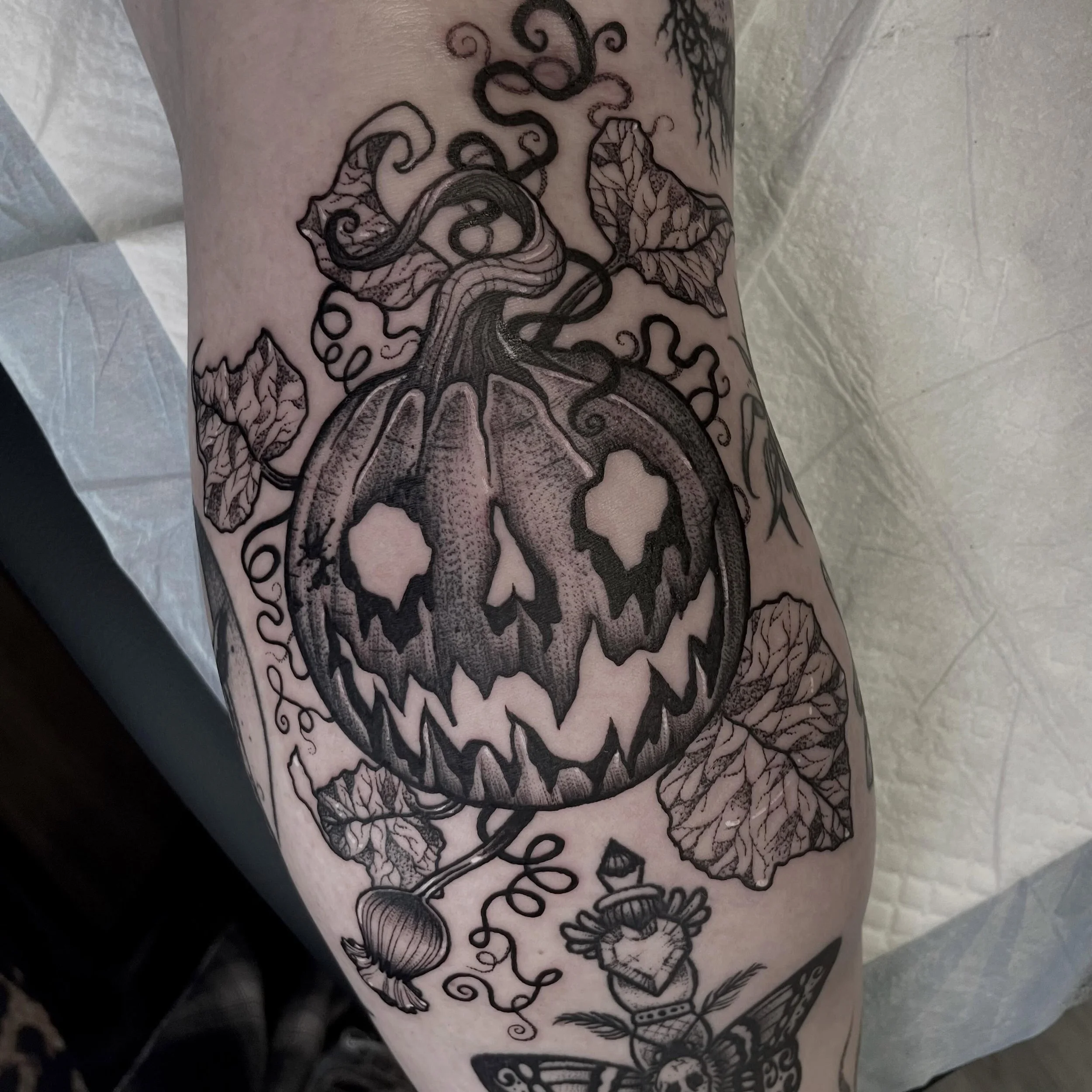 Jack-o-lantern for Jacki from today! It&rsquo;s plopped right on that spicy spot at the top of the calf, and the vines stretch right into the terrible, terrible knee ditch!

By the nine, she didn&rsquo;t even flinch or complain at all, because she wa