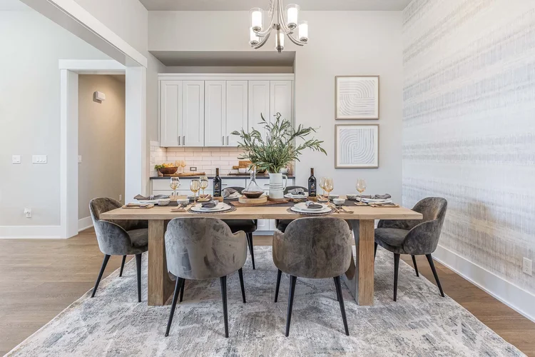 Dining room with a wood table and chandelier