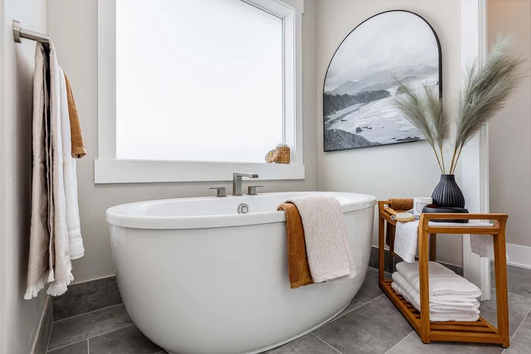 Freestanding soaking tub in a spa-style bathroom