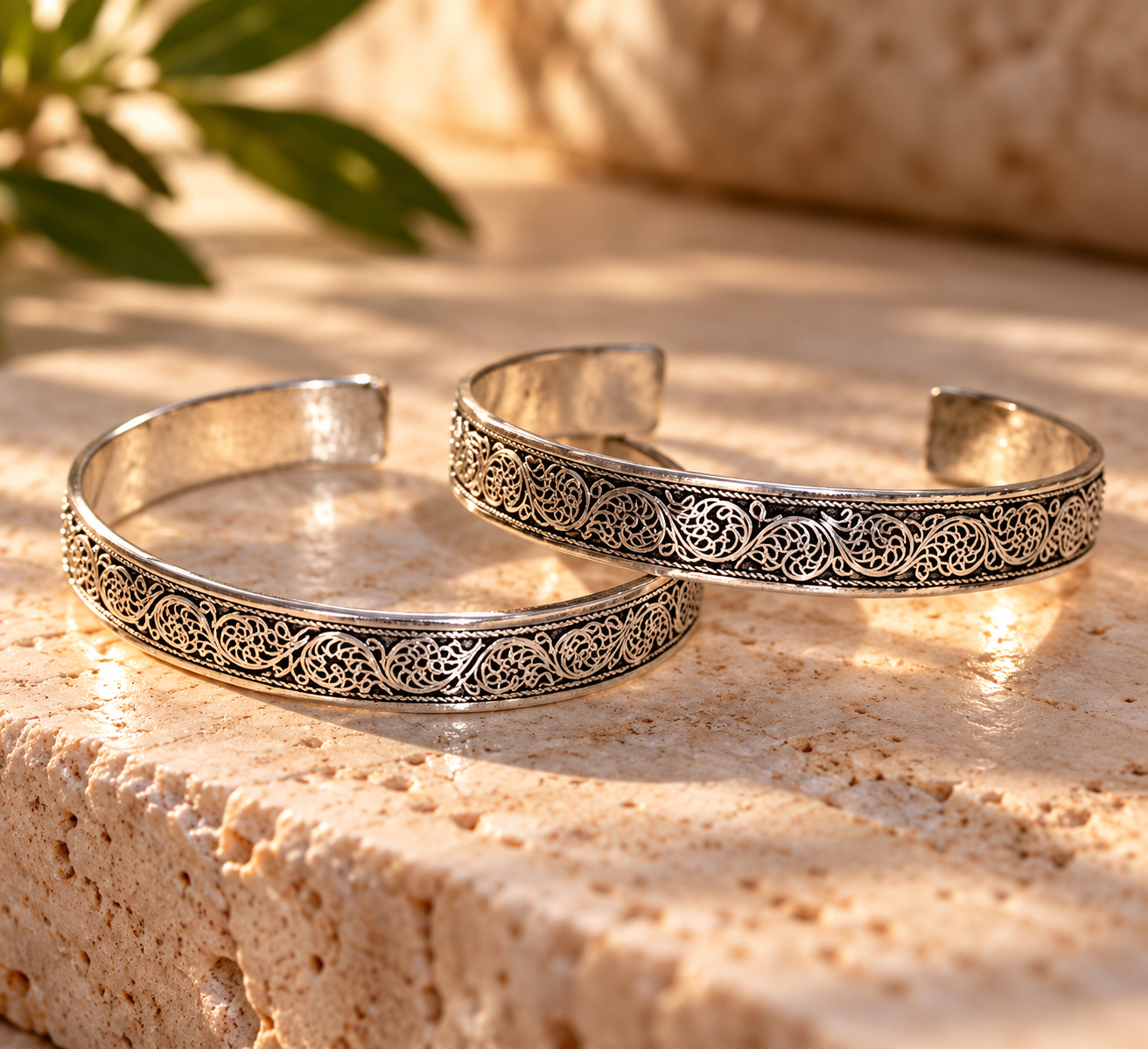 Engraved Silver Cuffs in Sunlight.png