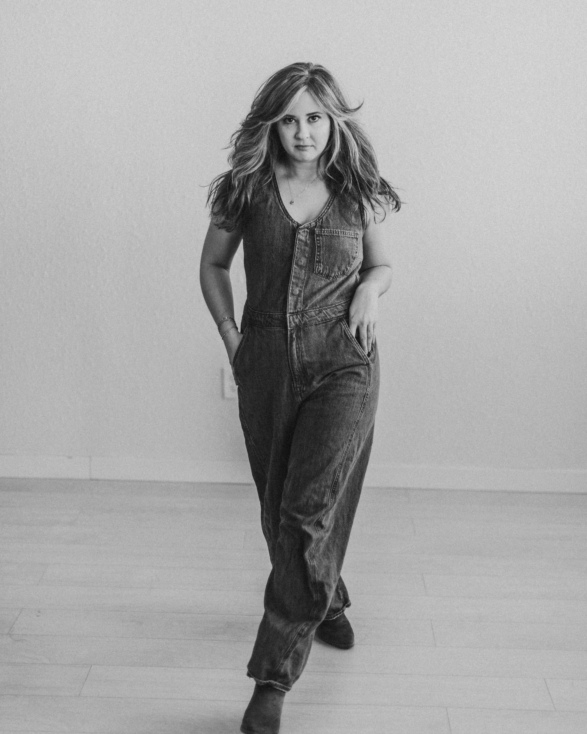 A woman walks in black and white