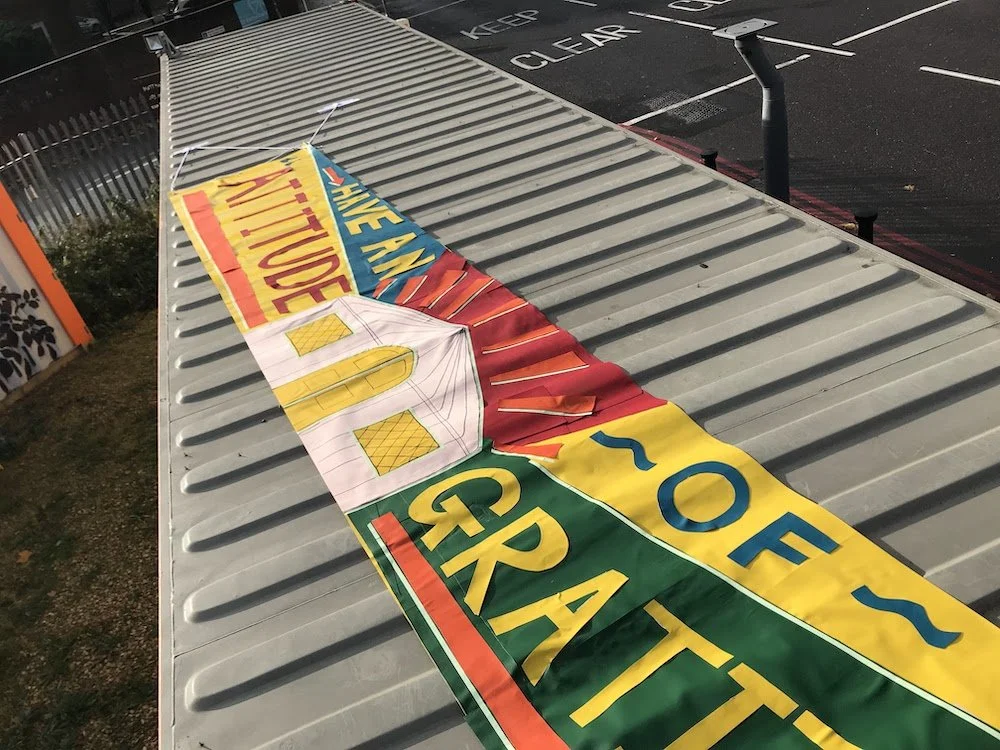 Banner on top of the container for the DLR passengers to view