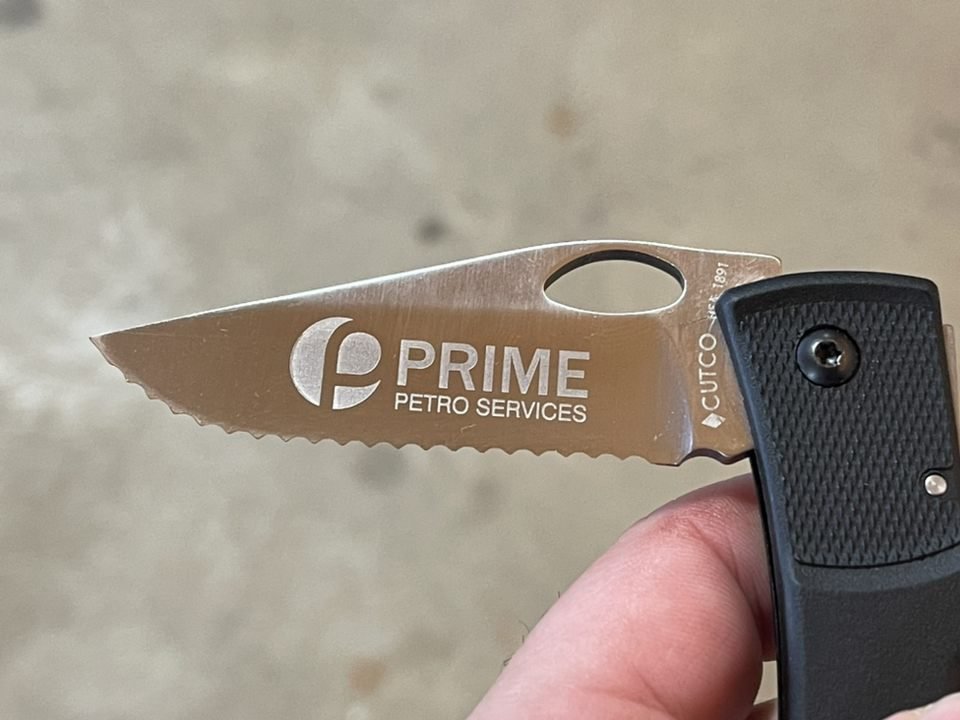 Pocket knife engraved with a company logo