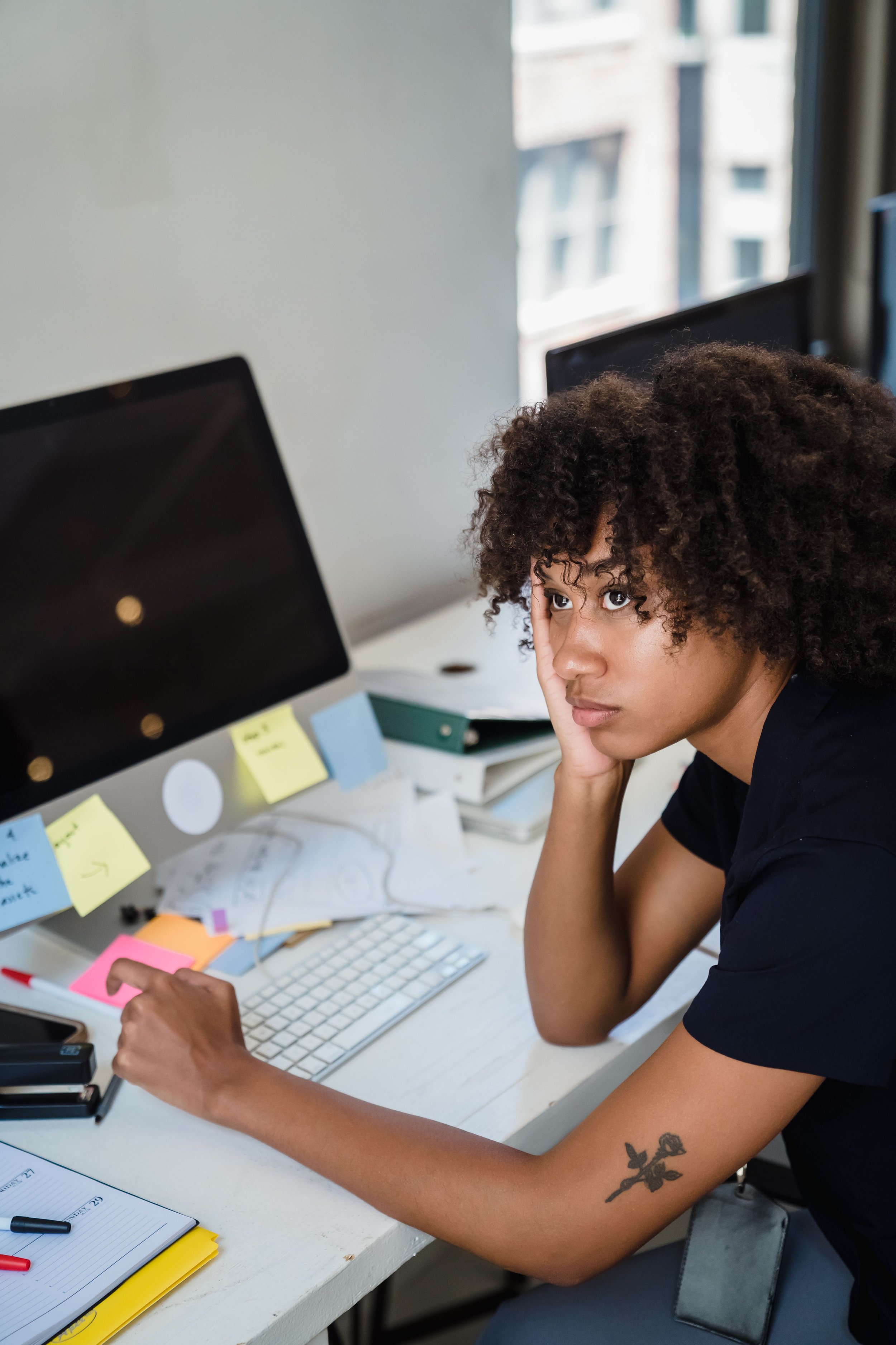 Black woman experiencing burnout in Chicago, IL