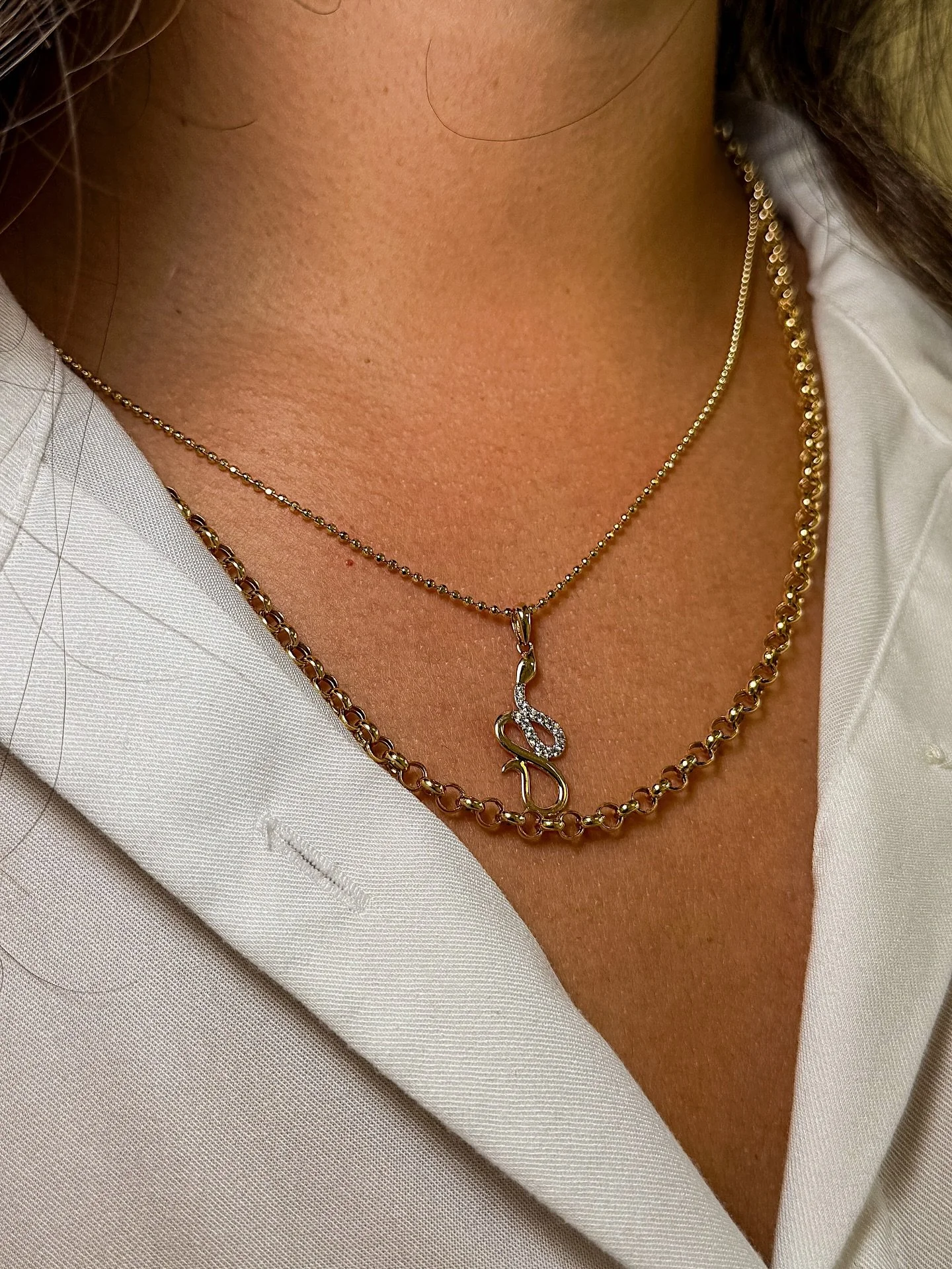 Delicate meets bold. We call that balance.✨⁠
⁠
Shop the Snake Pendant and layered chains &mdash; link in bio.⁠
.⁠
.⁠
#DeNocheJewels #JewelryDesigner #EverydayJewelry #MinimalJewelry #JewelryLover #MixedMetals #LatinaOwned #SmallBusiness #JewelryColle