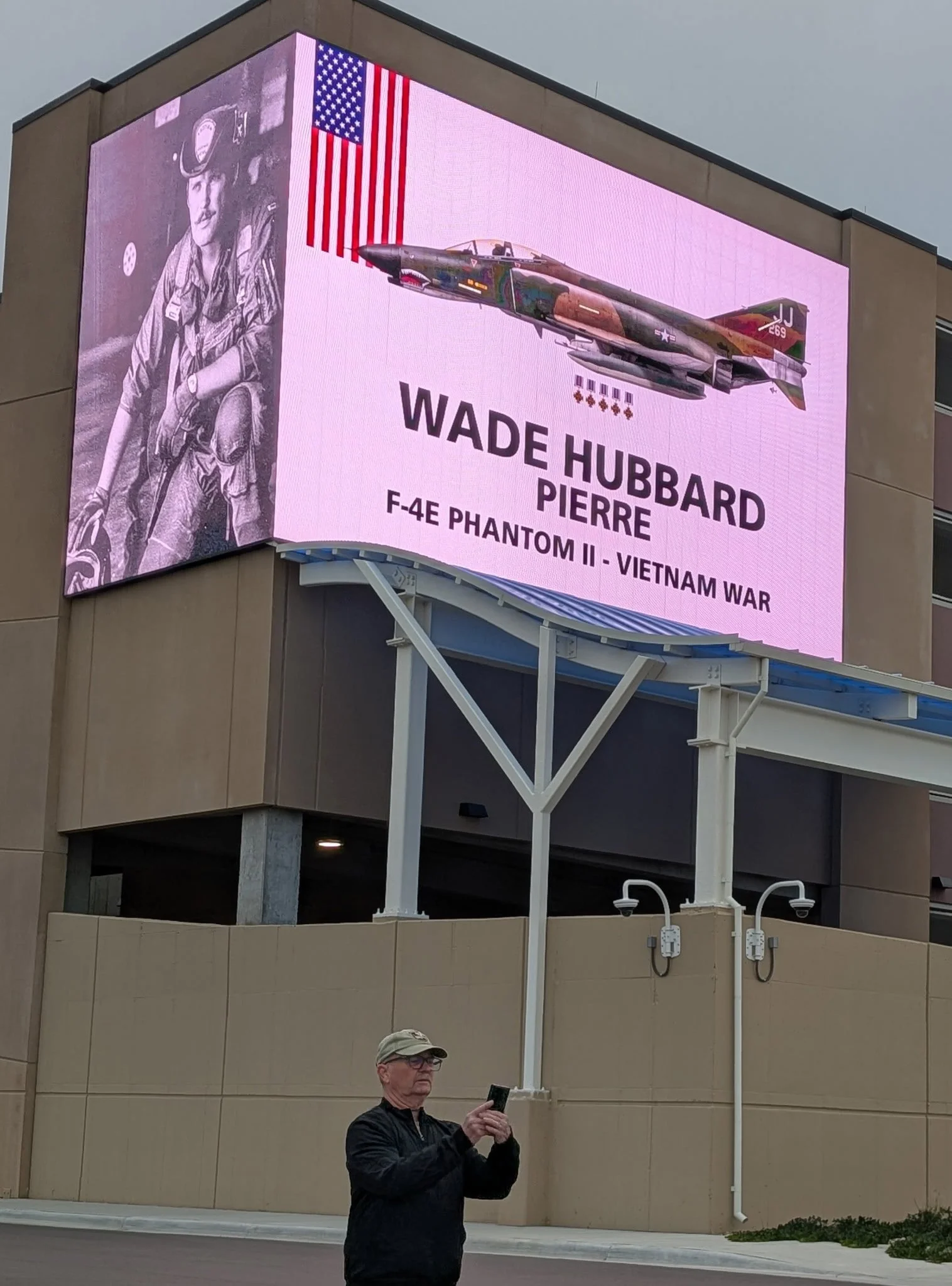 Sioux Falls airport put my art on their enormous  digital billboards - B-52G tailgunner Kim Morey is shown with Wade Hubbard's F-4E; Kim's B-52 is also featured, but Kim wanted Wade's bird in the spotlight.