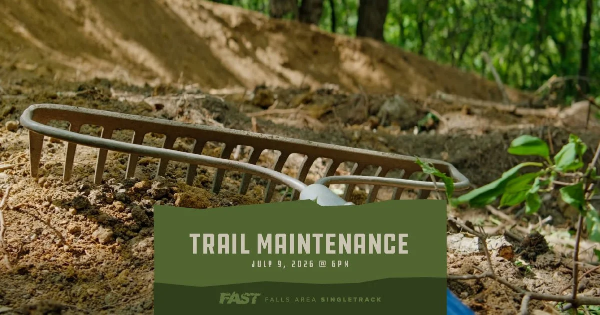 A wrake laying on a dirt trail