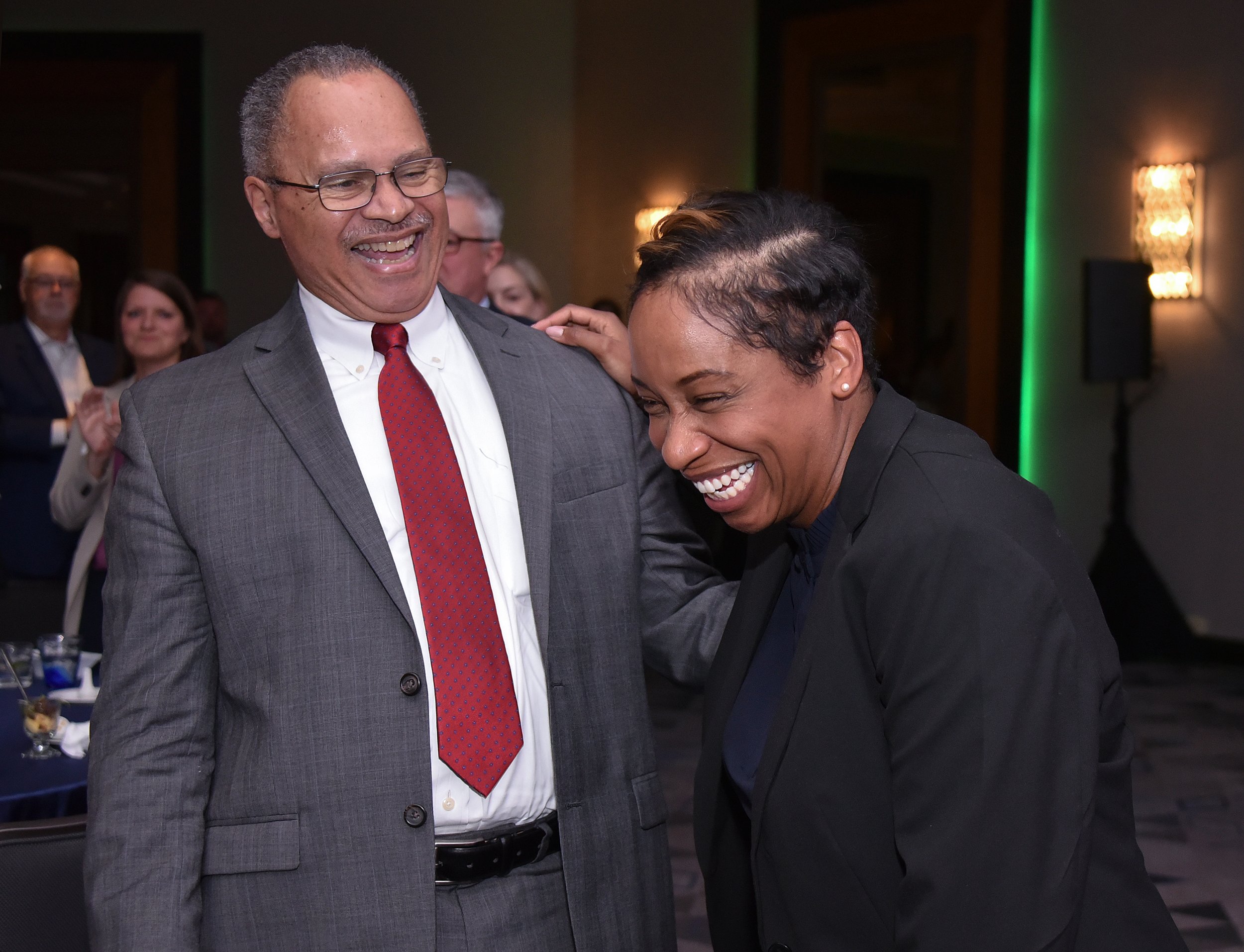 Bob Gittens and Attorney General Andrea Campbell share a laugh.