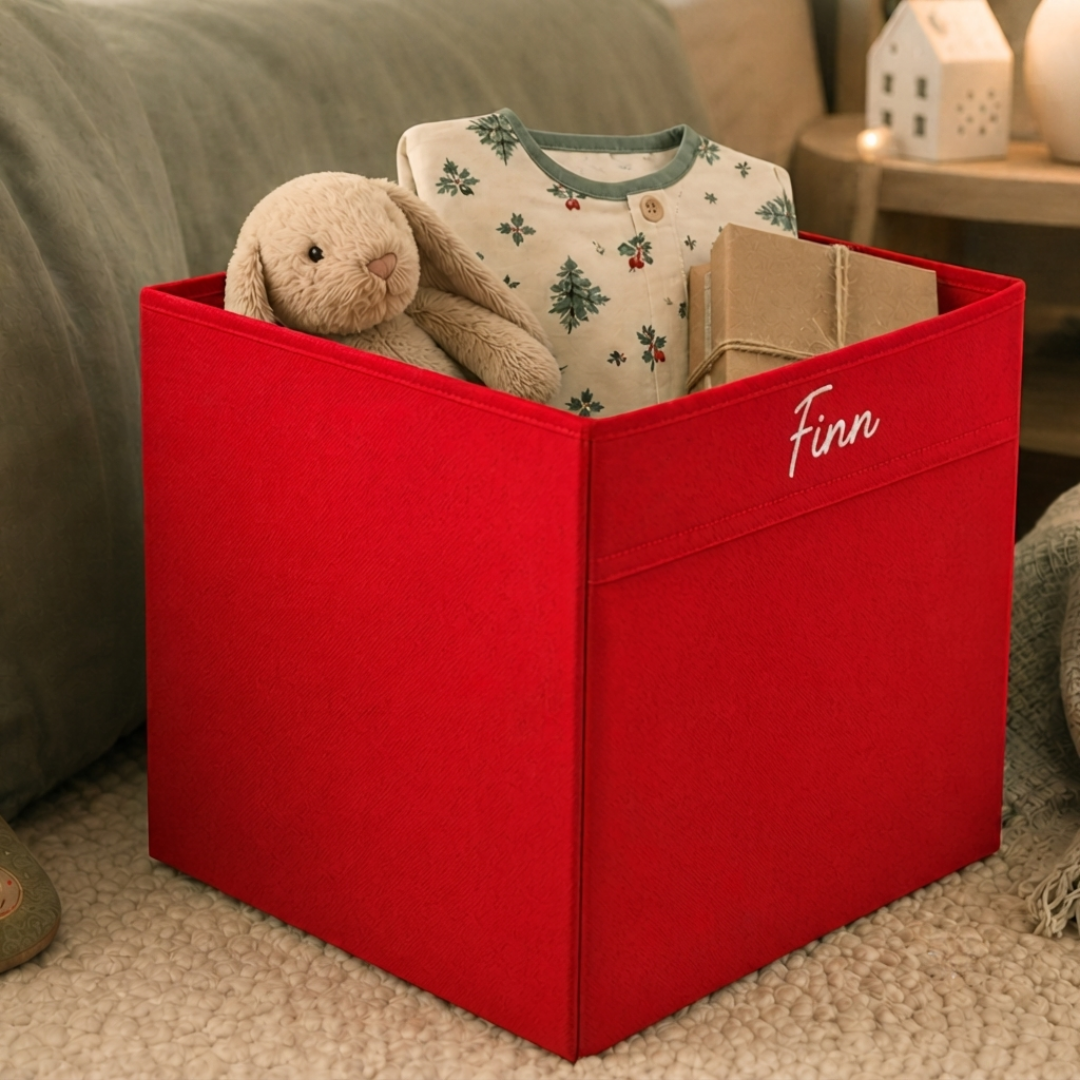 Personalised collapsible Christmas Eve box filled with pyjamas, books, and festive treats.
