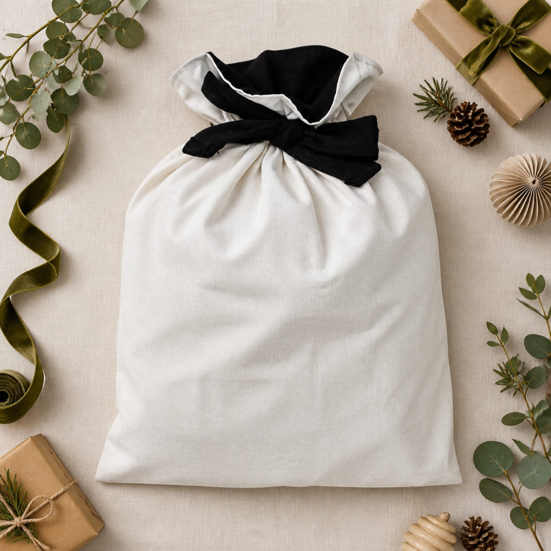 Luxe cotton Santa sack with a lined black interior and matching tie.