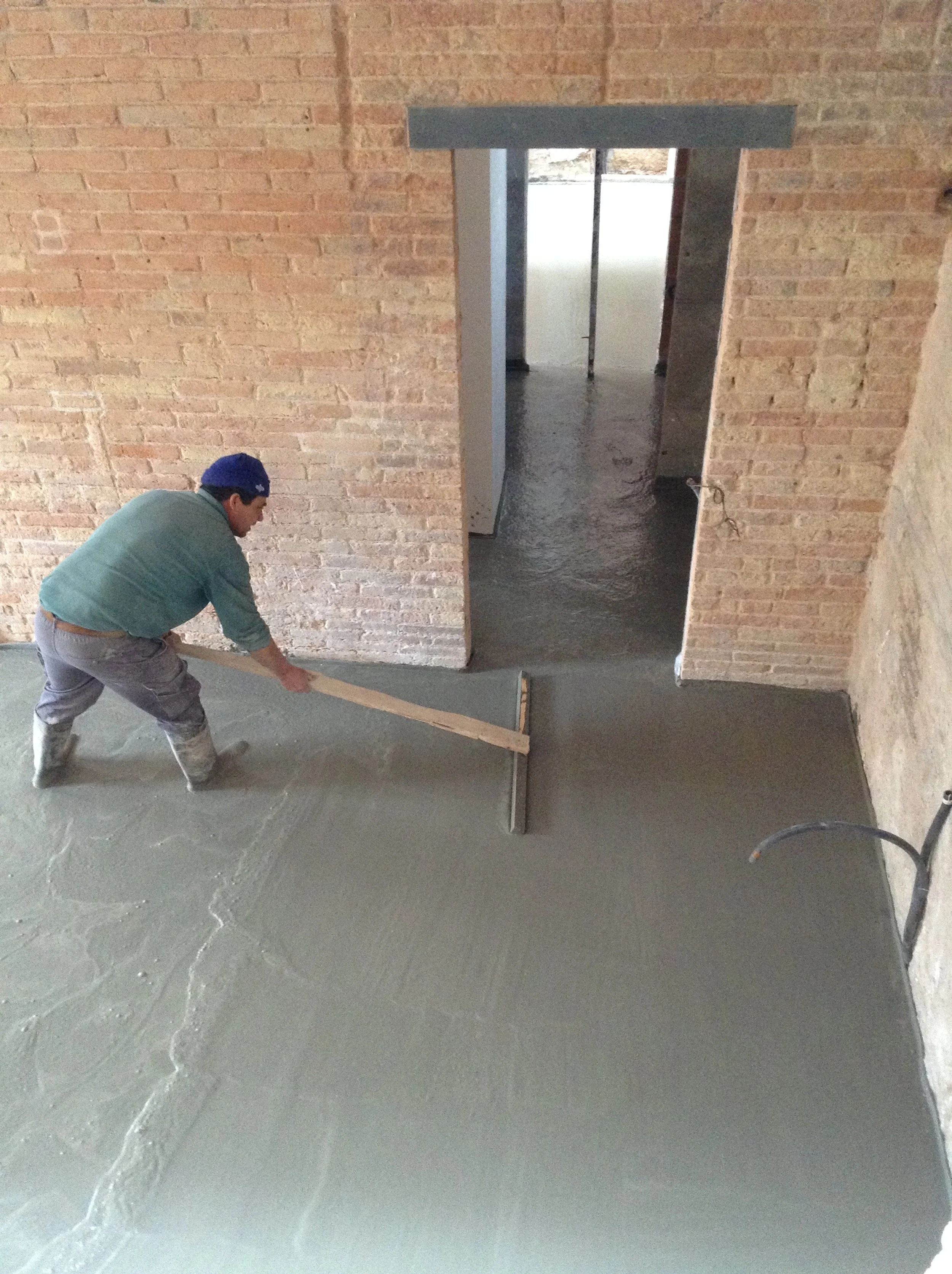 Pouring concrete over the radiant flooring
