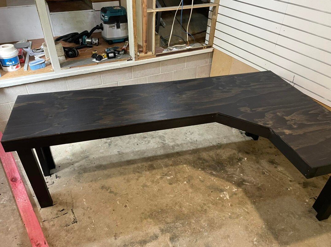 The client requested a custom desk to fit the room, since the budget was tight I had to make do with framing timber and spice it up a little with some black paint and a charcoal stain.