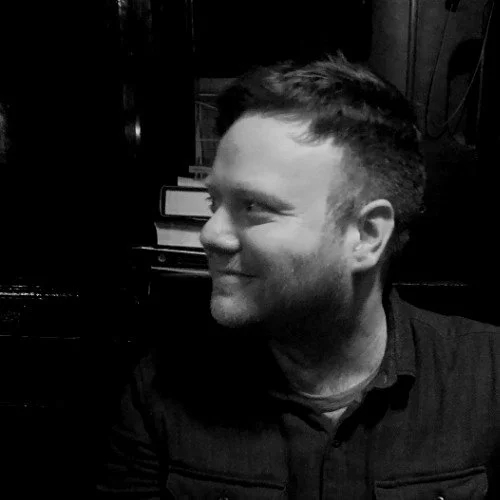 Side profile portrait of Liam Kilby in black and white