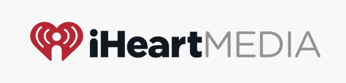 iHeartMedia logo featuring a red heart with radio signals and black and gray text.