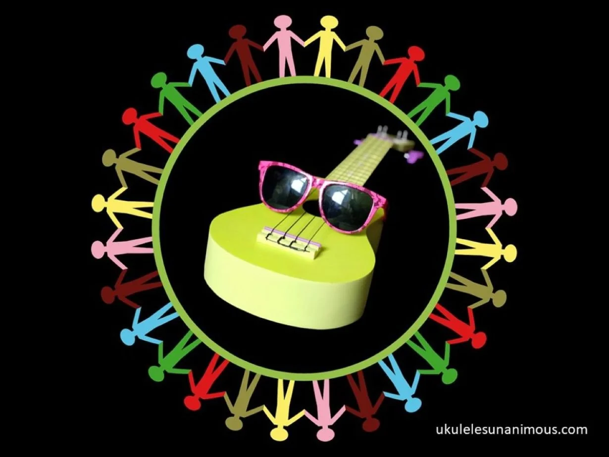 Green ukulele surrounded by circle of people holding hands.
