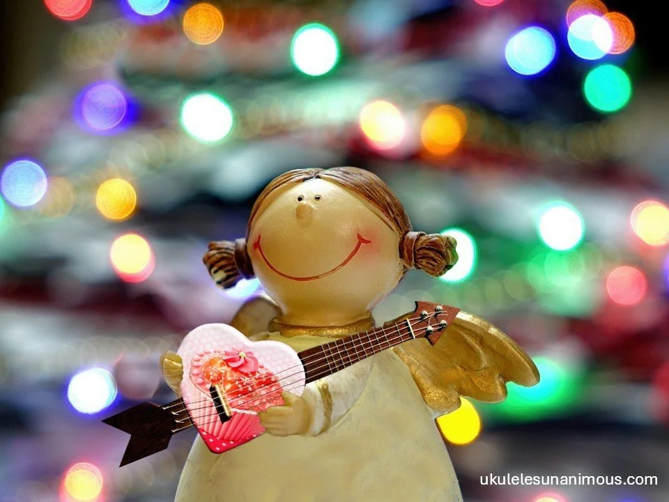 Christmas angel holding heart shaped ukulele.