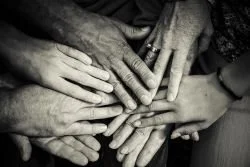 Many hands linked together.