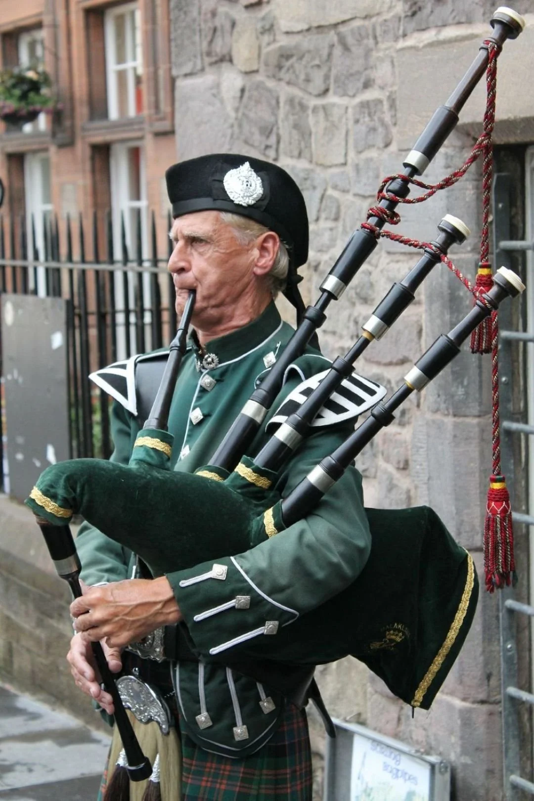 Man playing the bagpipes.