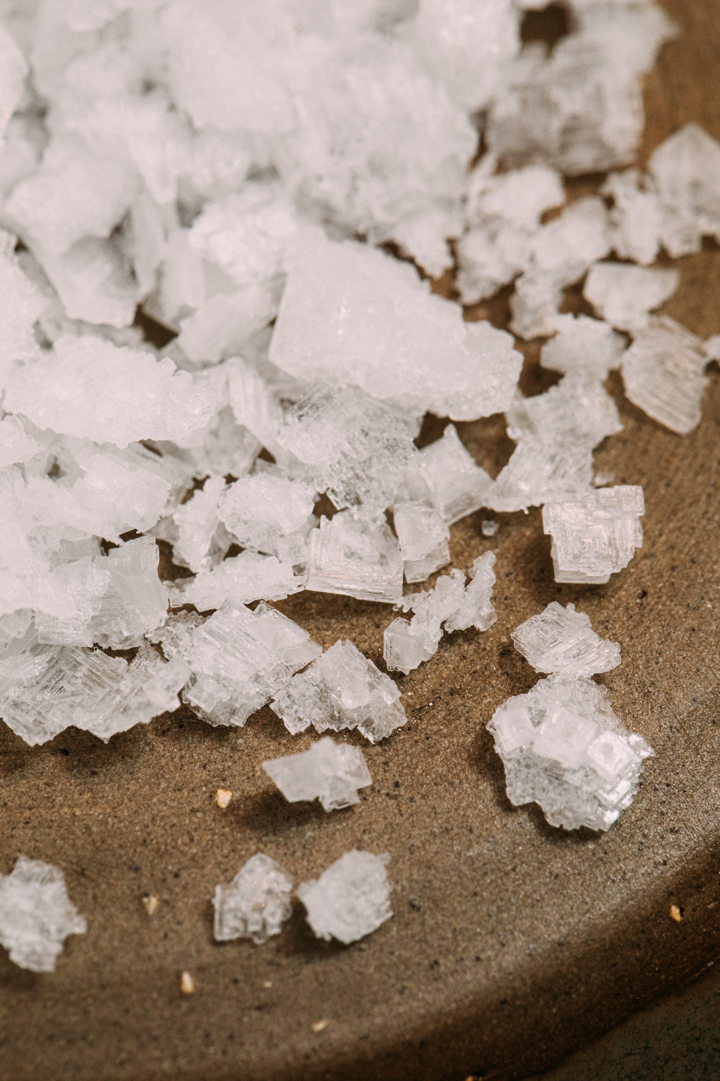 Pink tinged sea salt crystals.