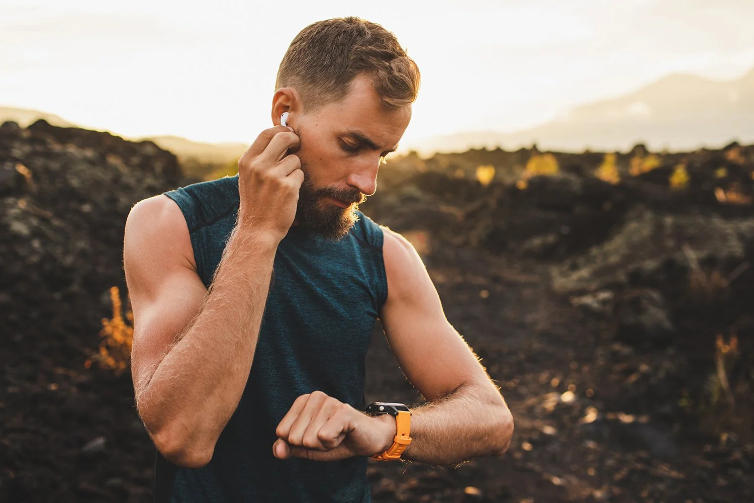  A trail runner stops to check his wearable. When you hit the trails in Boulder, be sure you know the right trail etiquette with our Ultimate Hiking Guide to Boulder Trails.  