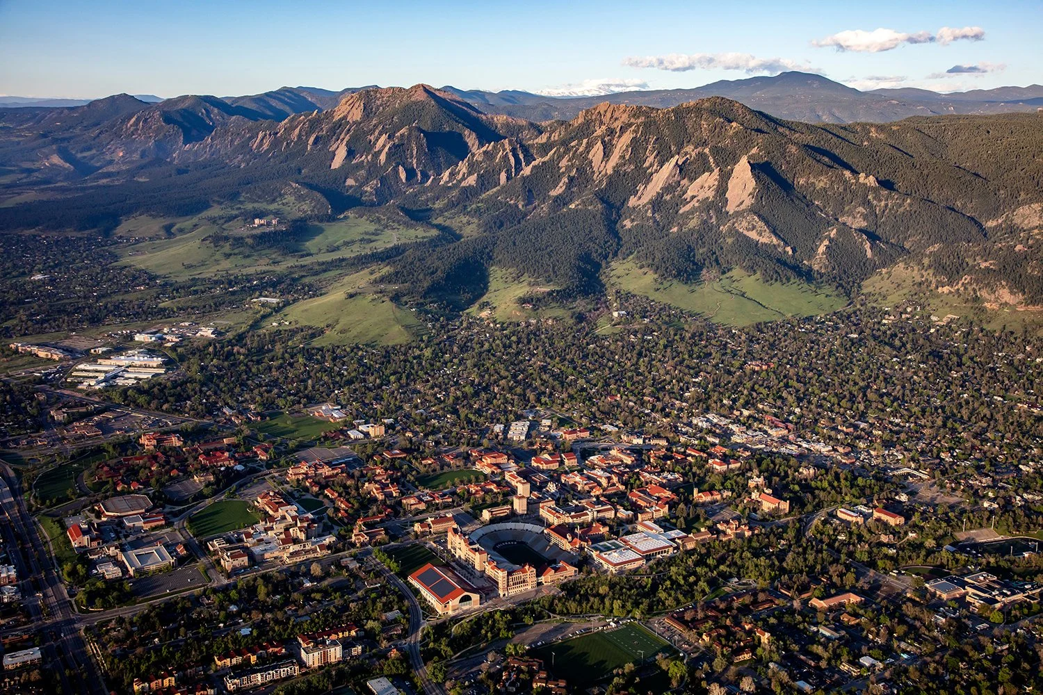  An aerial view of Boulder, Colorado shows the famous flatiron formations backdropping the college mountain town. Looking for the best hikes in Boulder? Check our our Ultimate Guide to Boulder Hikes to find your favorite new trail. 