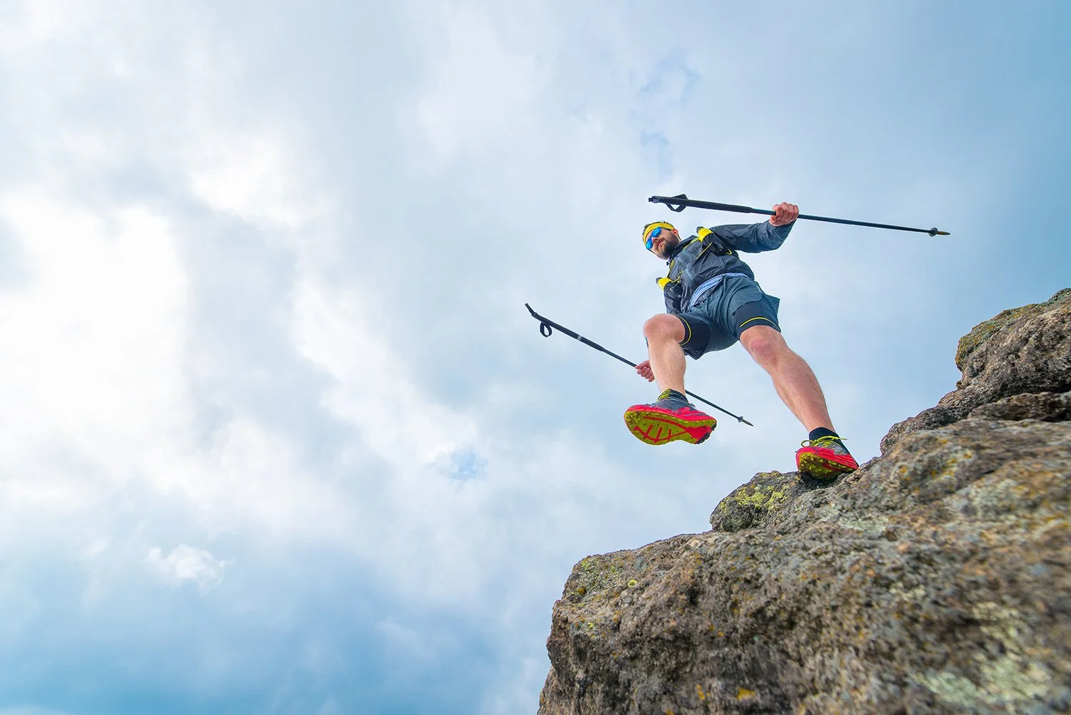  A man climbs down from a hike carrying trekking poles. Looking for the best training hikes in Boulder? Check out our Ultimate Guide to Boulder Hikes and discover your best trails for getting in shape and leveling up your hiking game. 