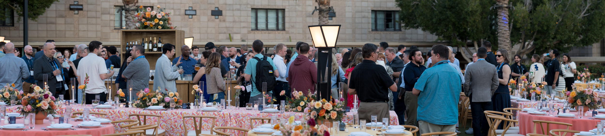 Tons of guests mingling at designed dinner