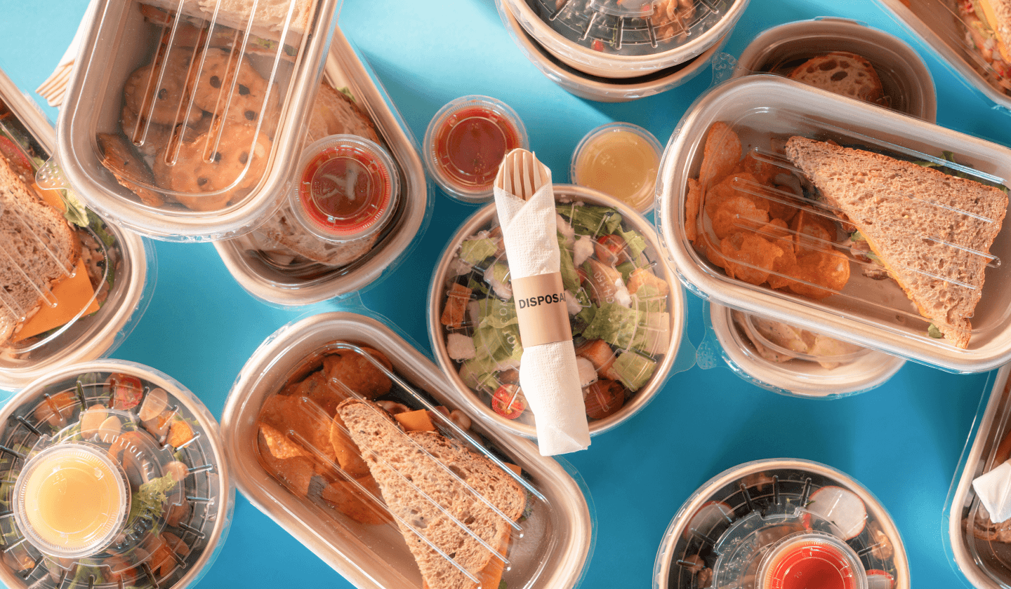 Top down photo of individual meals on a blue background