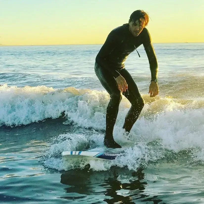 Teenager riding a small wave during a Los Angeles surf lesson