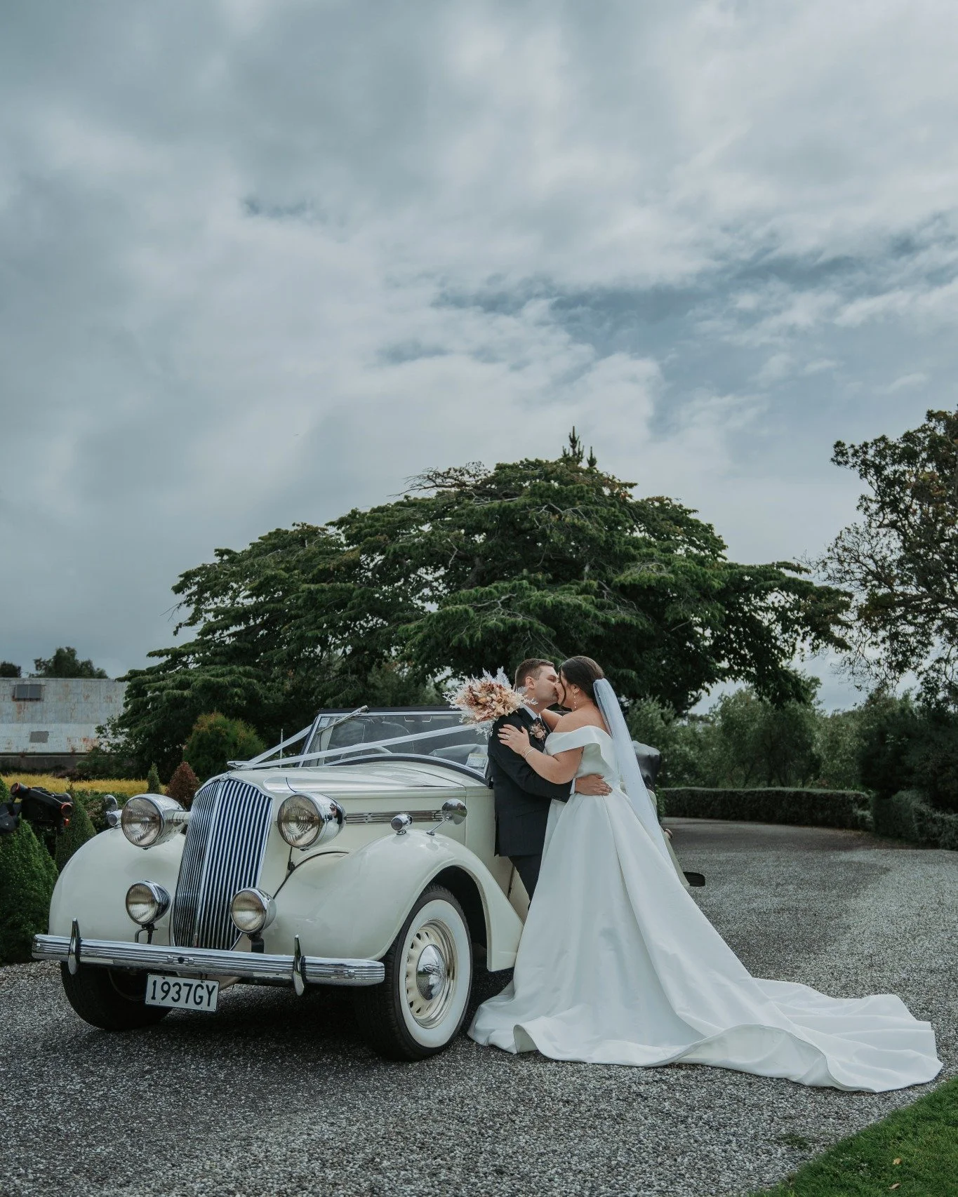 If you have a classic car or a meaningful family vehicle, give it five minutes.

Whether it is driving you to the venue or simply there as part of the day, setting aside a few minutes after the ceremony or group photos is more than enough to create s