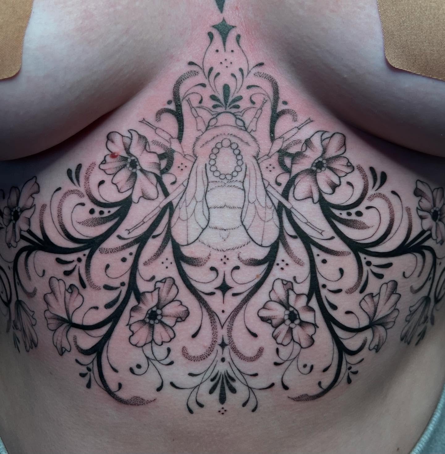 An ongoing ornamental project for @karlicolorss 
This has been such a fun project! 🥰 super excited to finished it up 

-
Swipe to see healed lines ✨

Books open for May and June!📖
-
#mntattooers #ornamentaltattoos #dotworktattoo #beetattoo #blackan