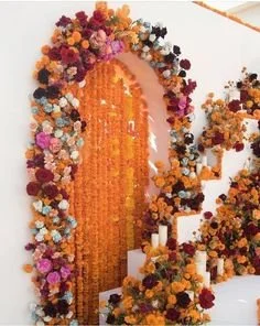 An archway decorated with marigolds.