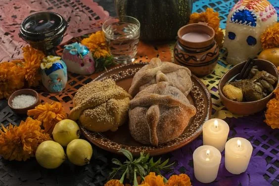 Small bowls of salt are placed on an ofrenda to represent purification