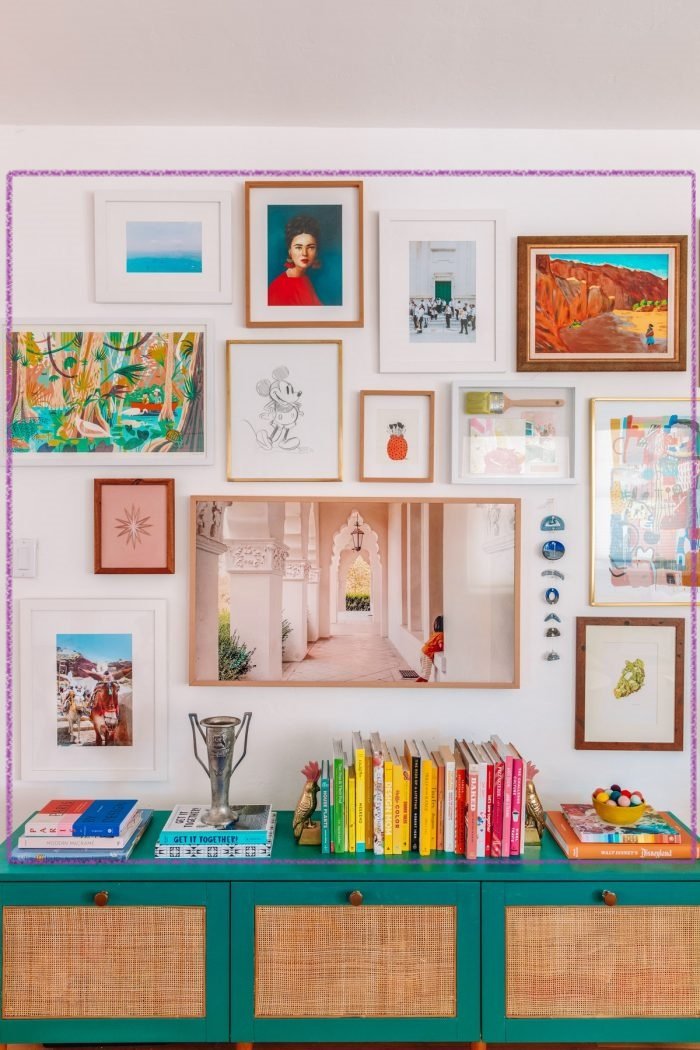 This gallery is interesting in that it uses the décor items on the cabinet below to round out the shape of the square.