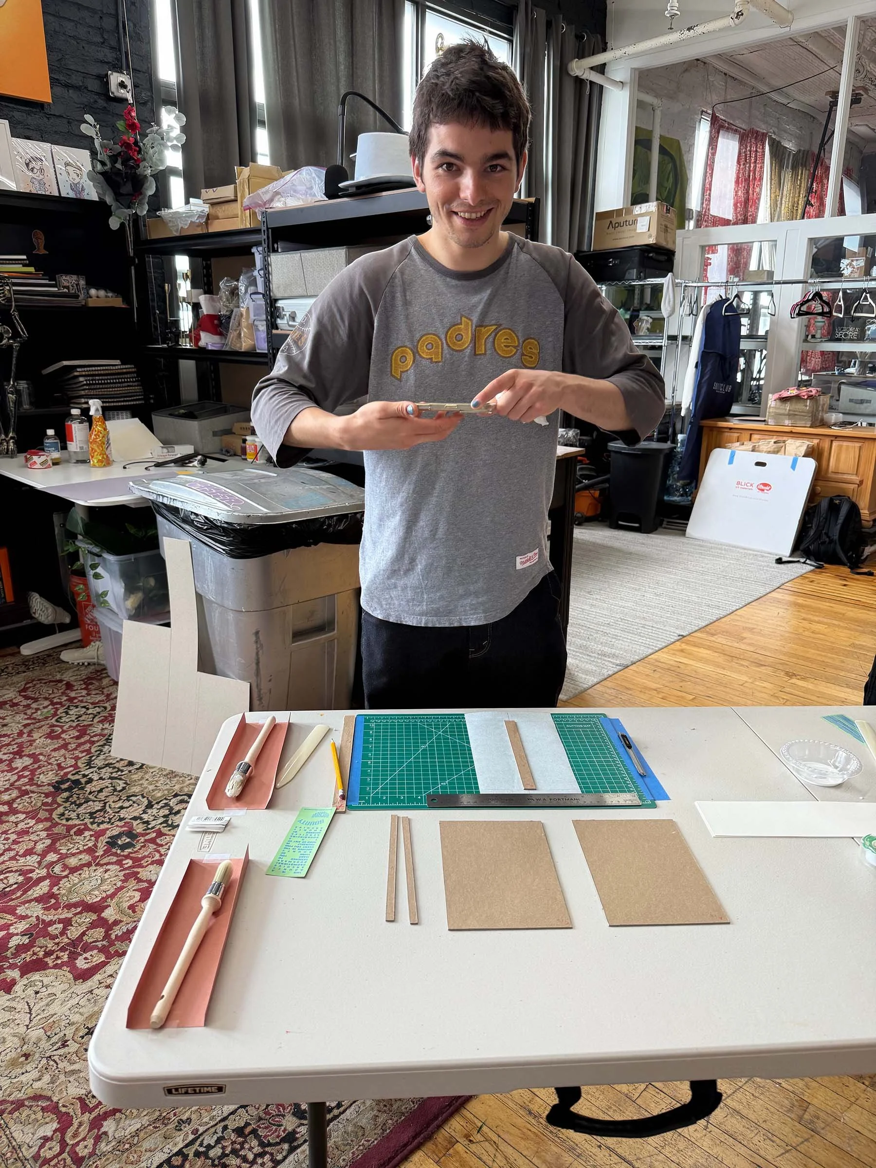 Caco Making a book.jpg