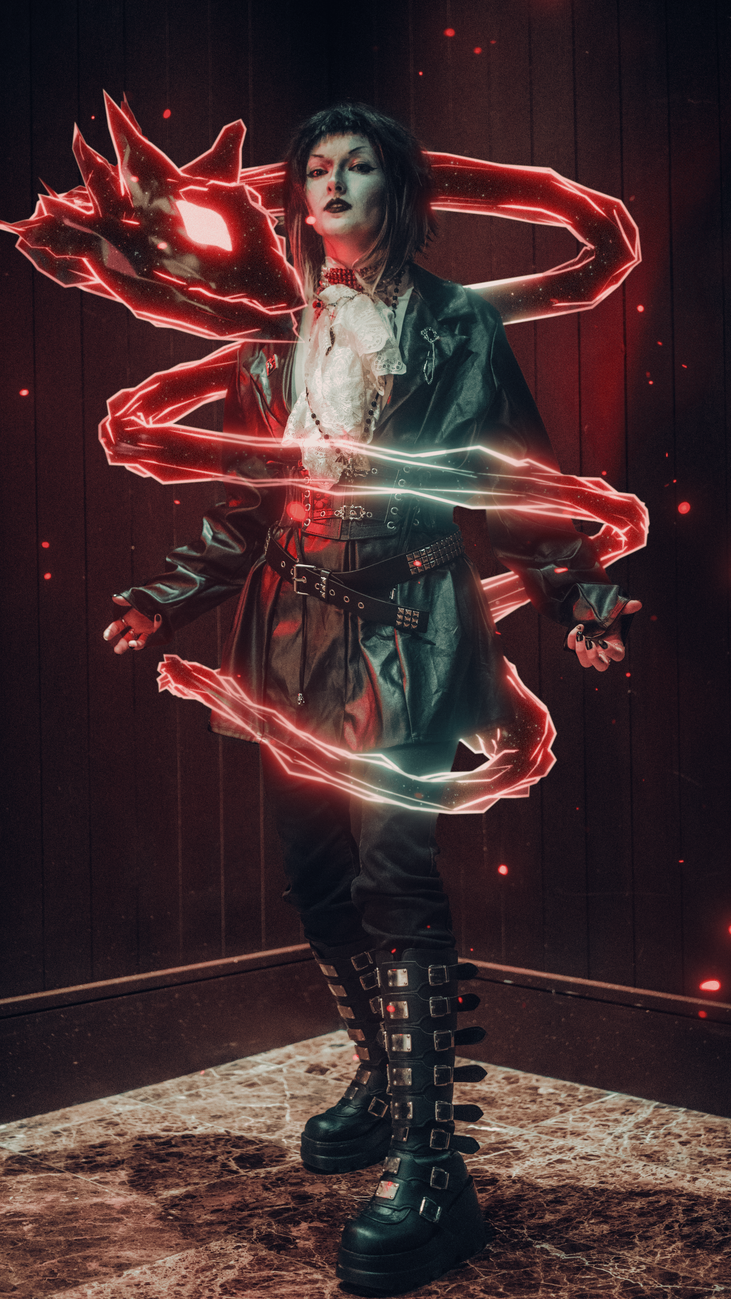 A woman with dark, messy hair and dark makeup, dressed in a leather jacket, lacy shirt, and oversized boots with buckles, standing in front of a dark wall with a digital red dragon outline and light trails around her.