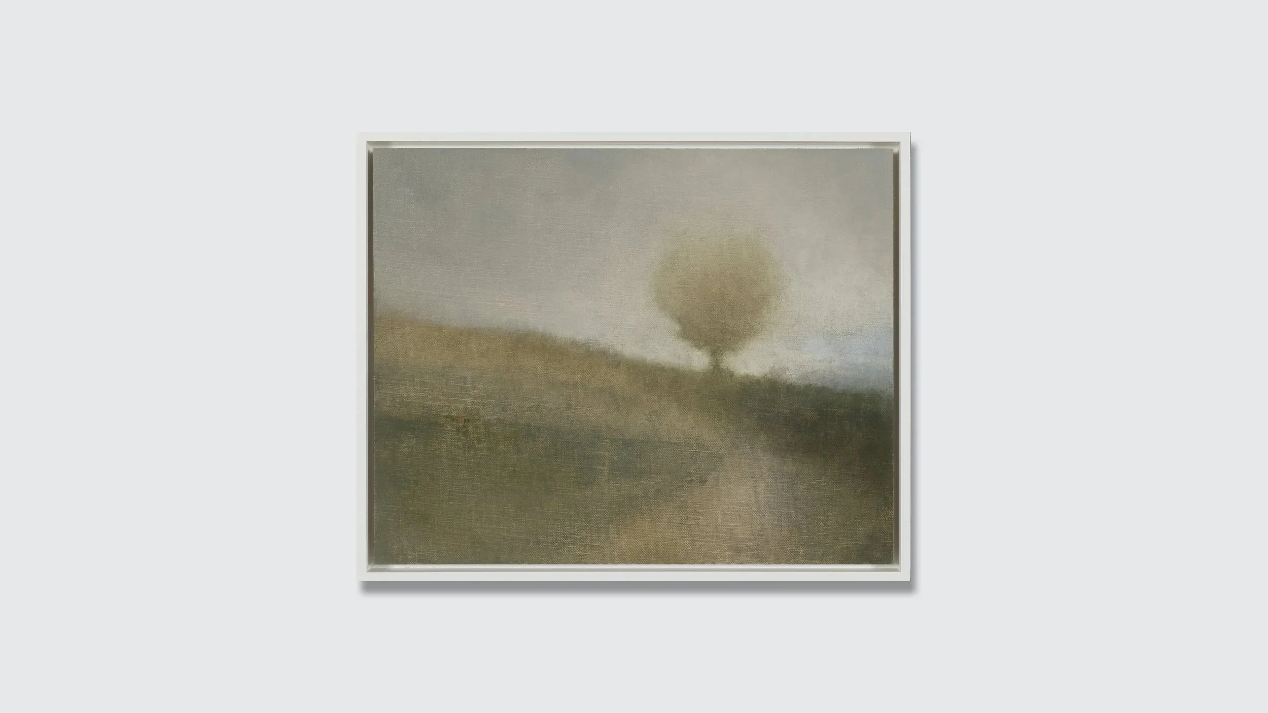Framed landscape painting in muted colors.
