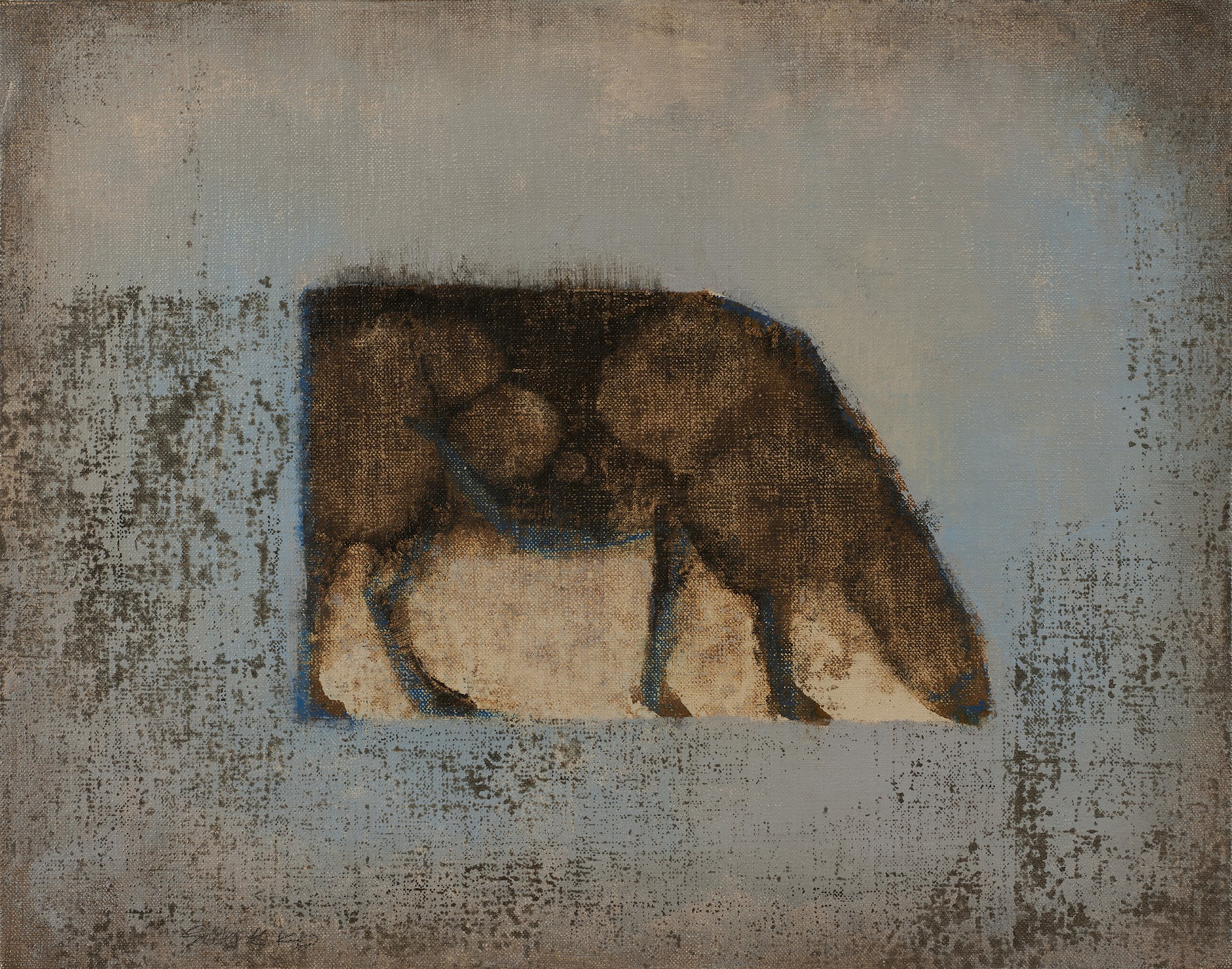 Grazing cow on an abstract field.