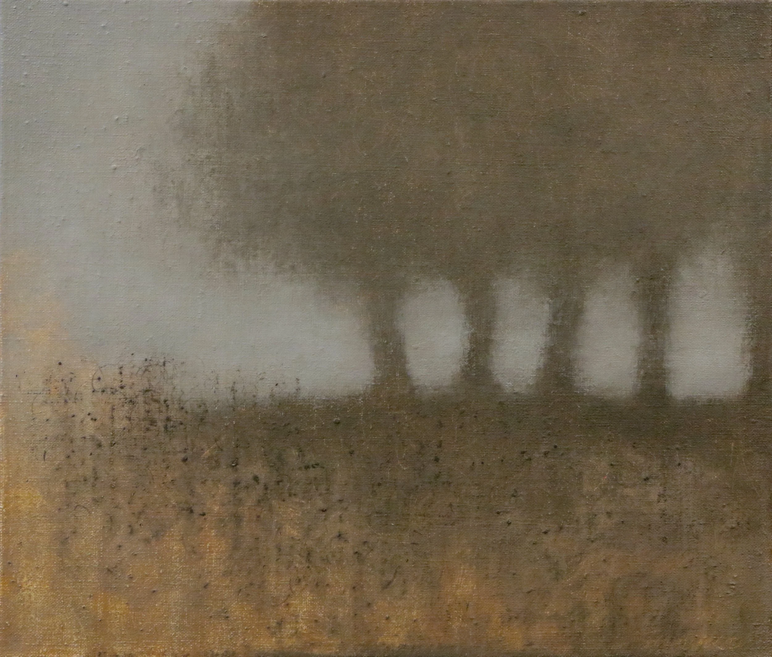 Evening trees dissolving into soft gray light.