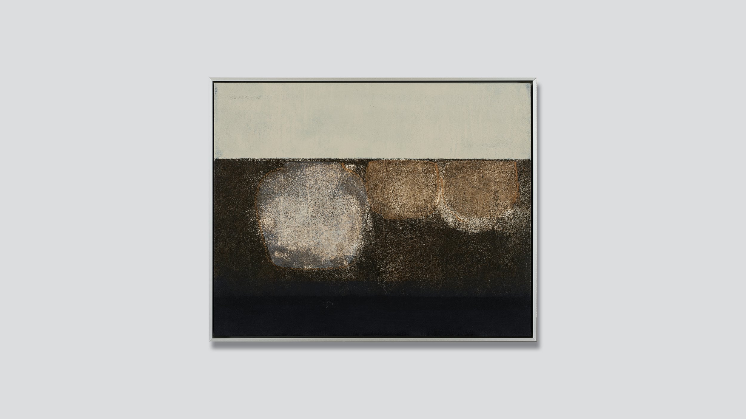 Framed abstract still life in earth colors.