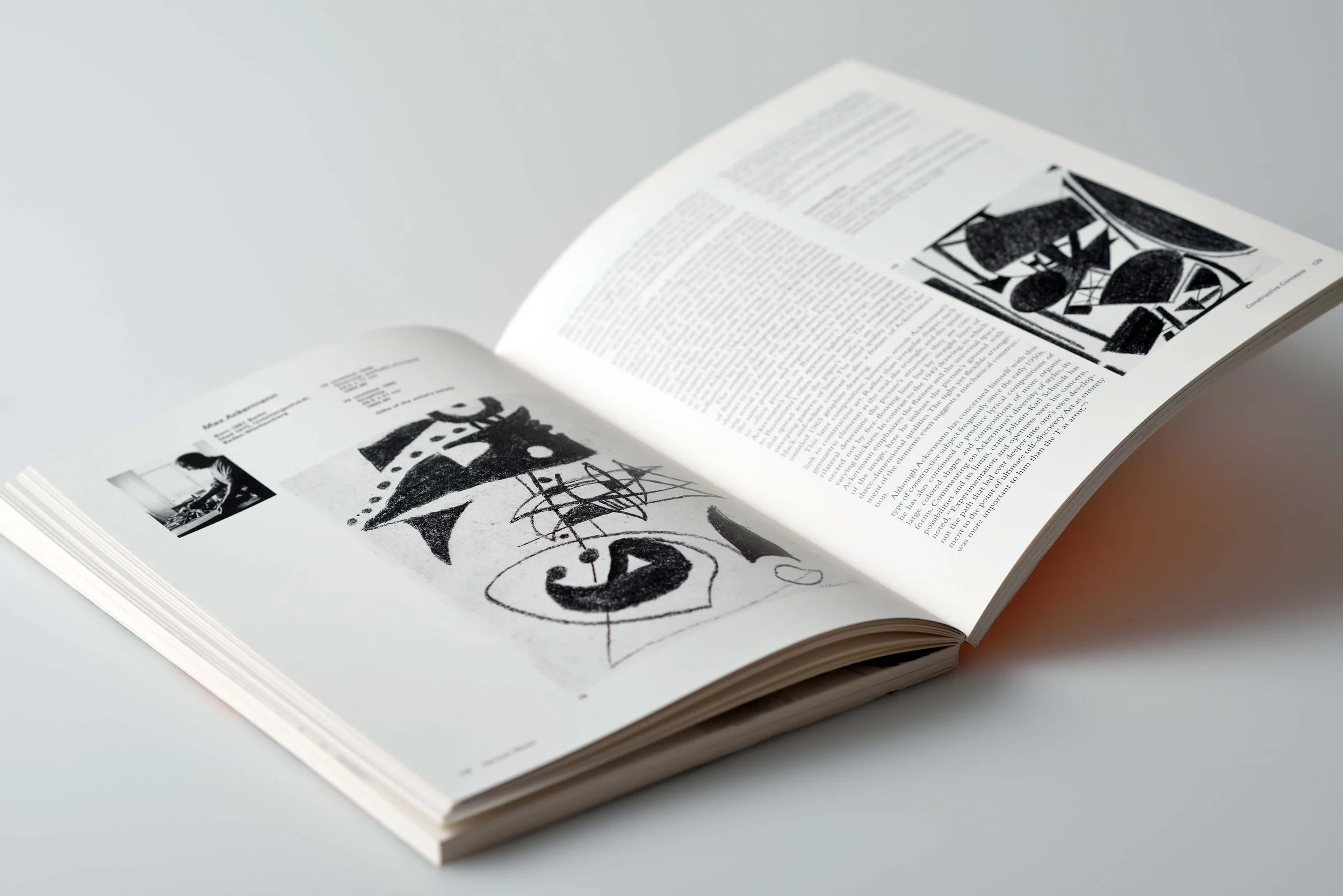 An open book, exhibition catalogue design by Glenn Suokko.
