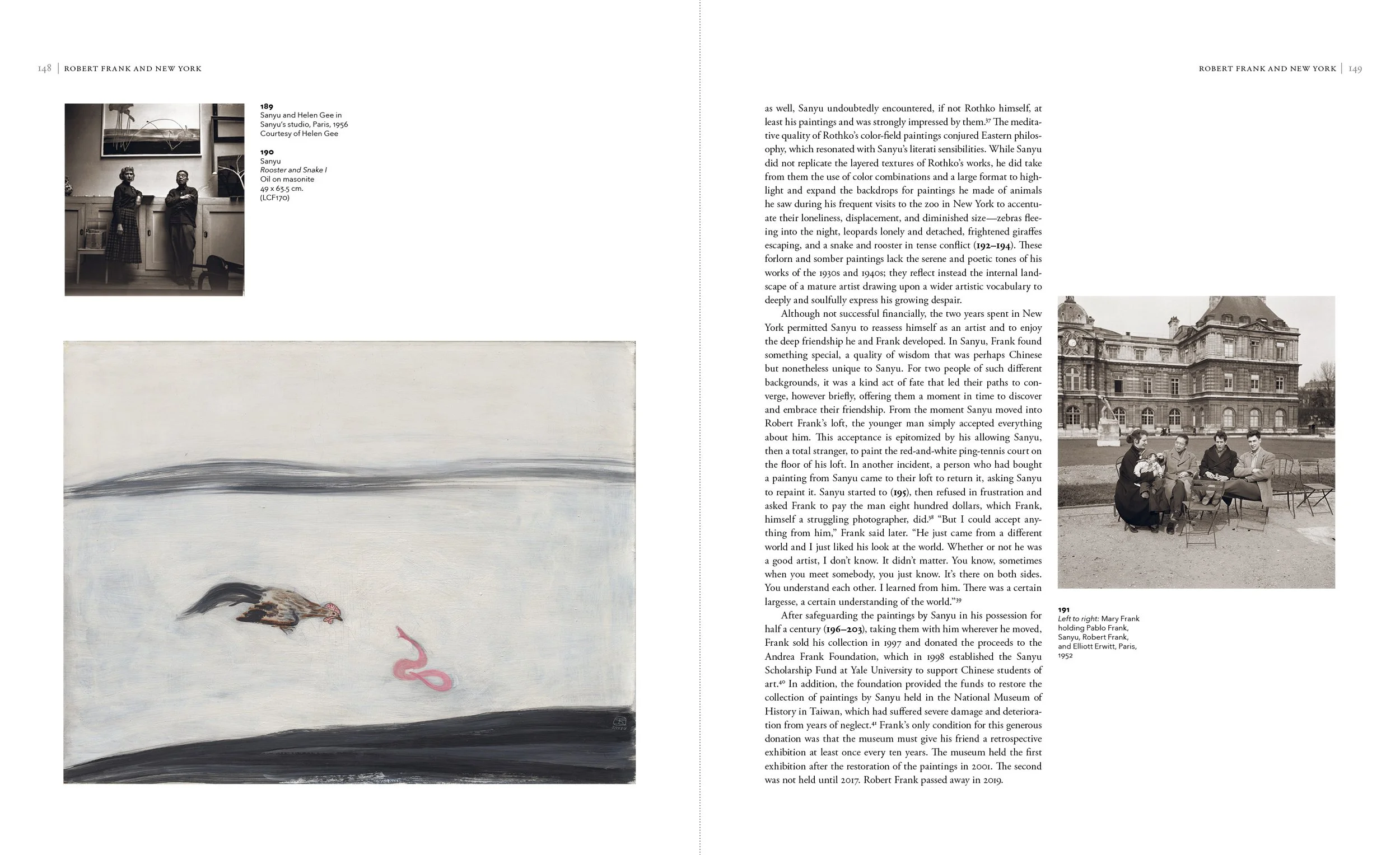 Black and white photograph of five people sitting outdoors in front of a large historic building, with a woman holding a baby and a man holding a cigarette.