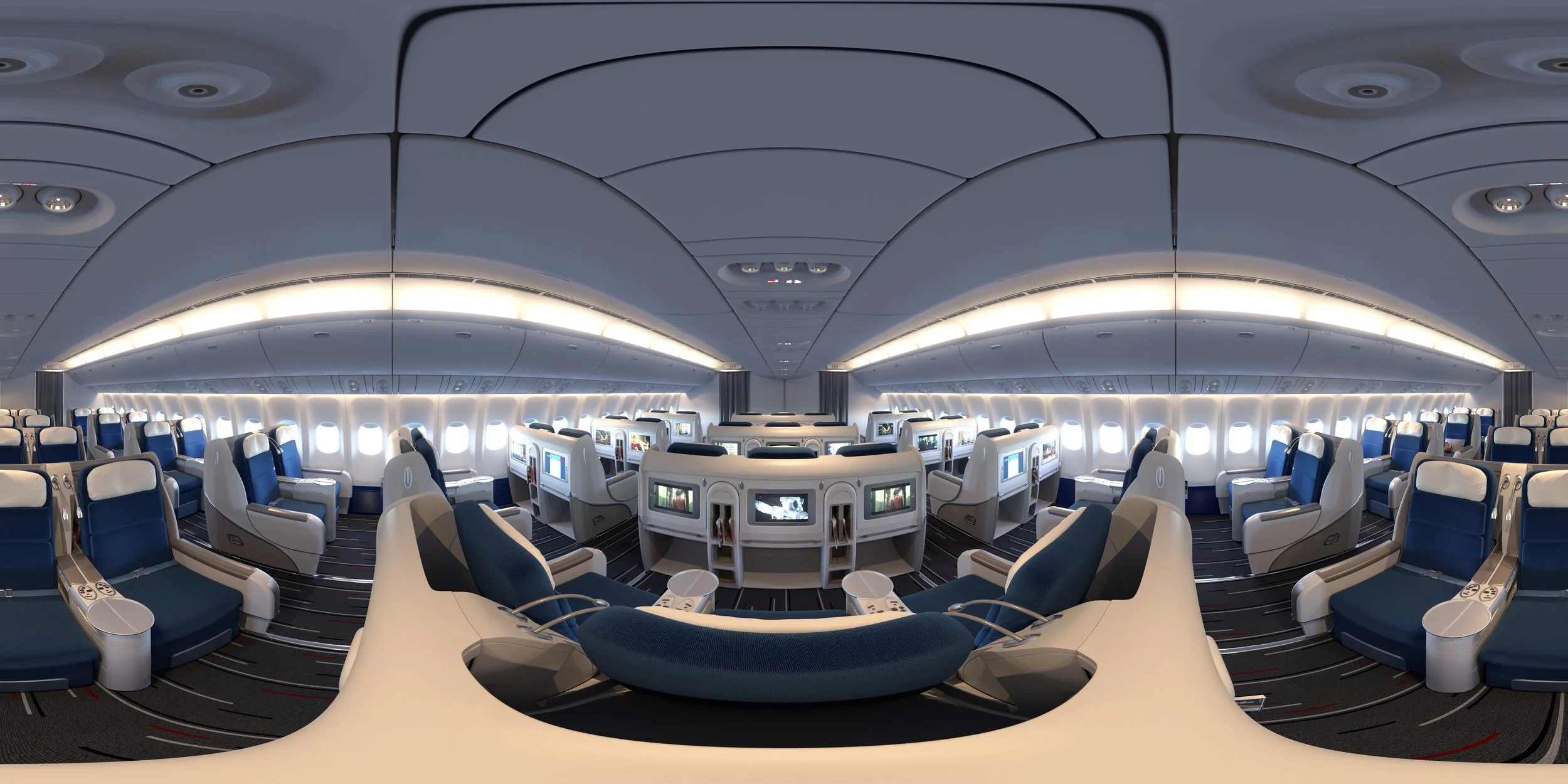 Interior of an airplane cabin with business class seating, featuring spacious seats, individual screens, and overhead lighting.