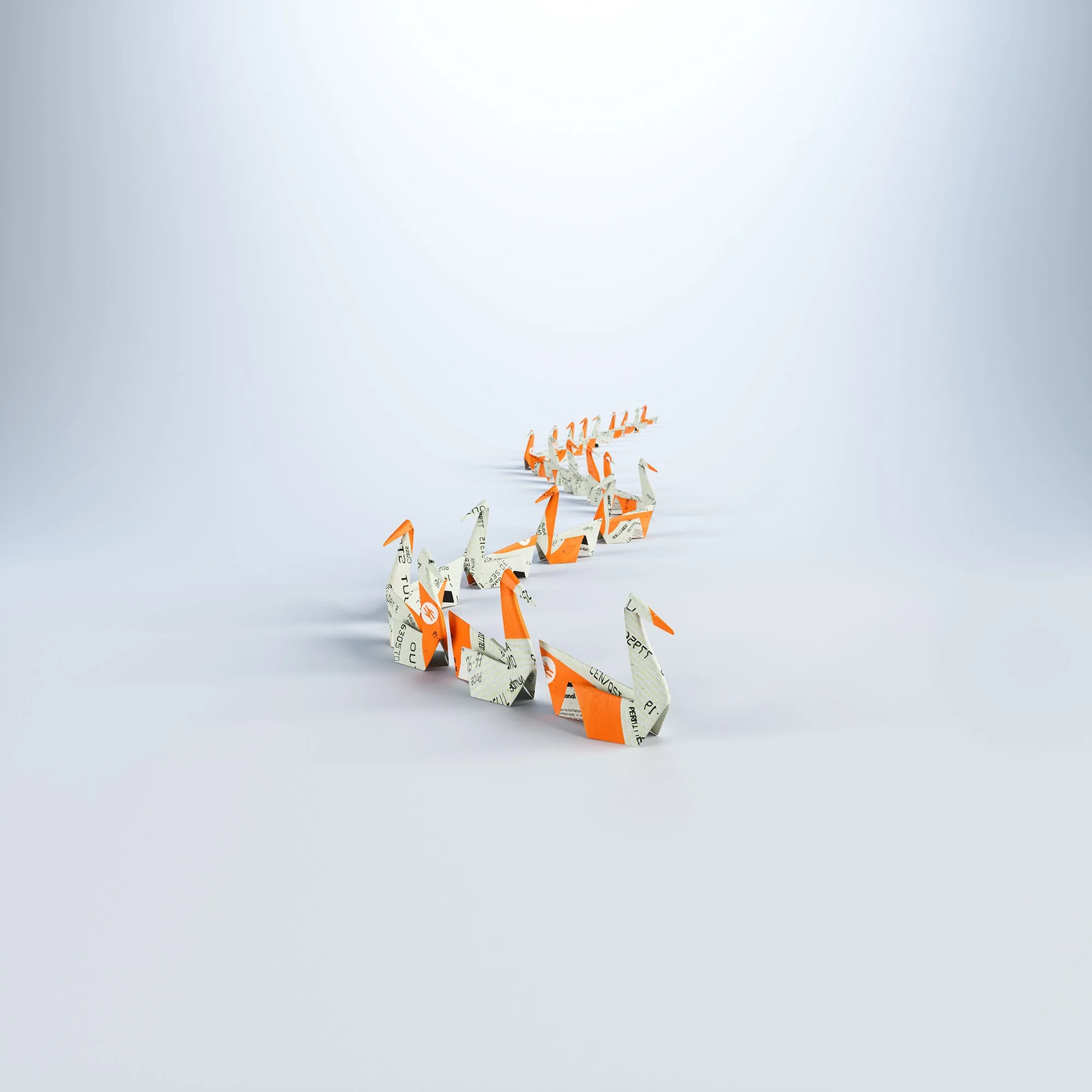 Origami swans made from currency notes, arranged in a diagonal line on a light background.