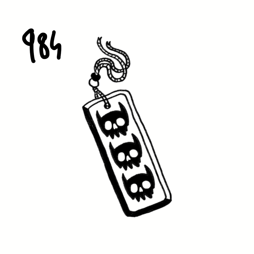 Black and white drawing of a LEGO piece with three skull designs, attached to a string, and the numbers 984 in the top left corner.